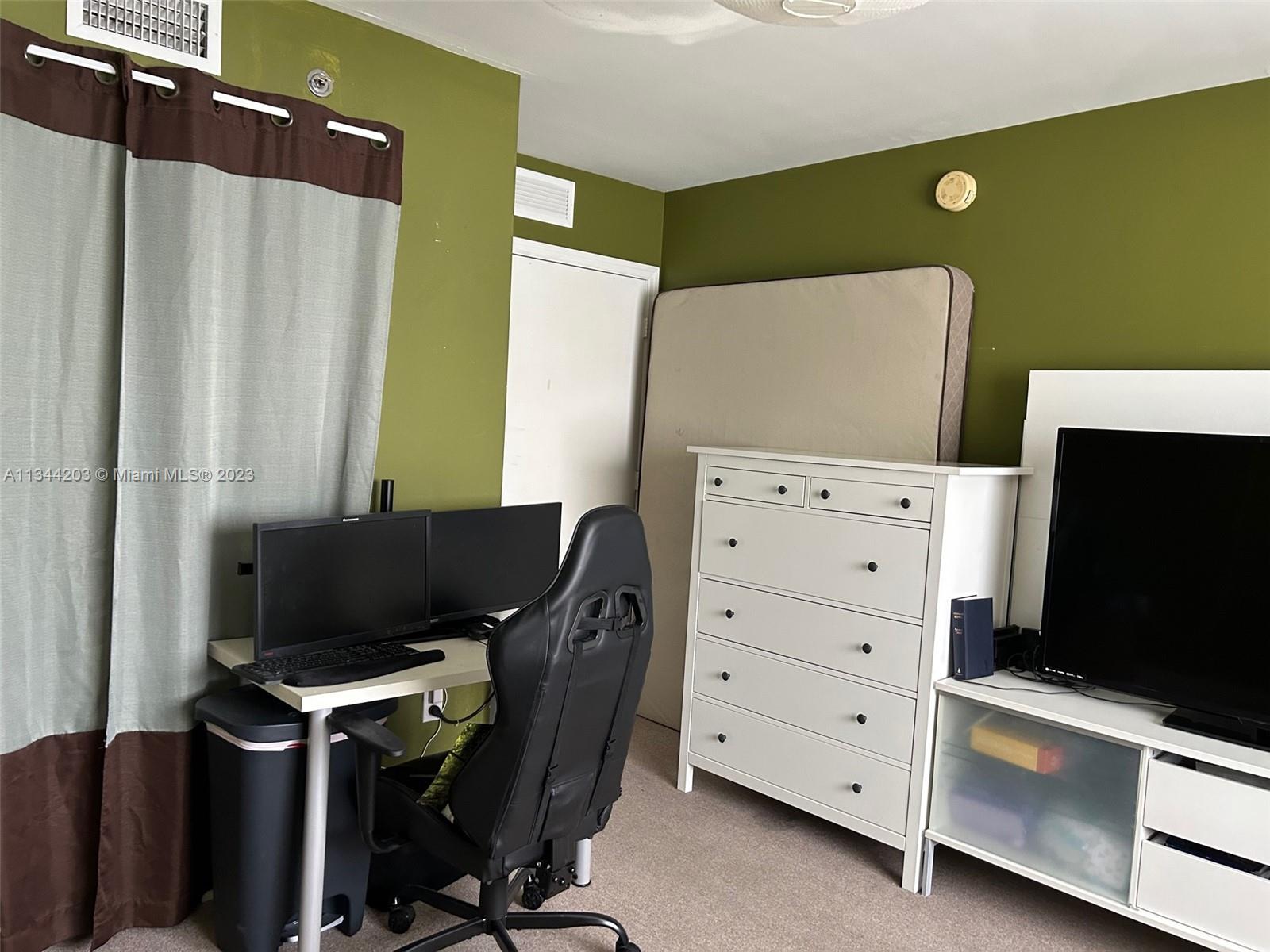 55 East 4th Street, Unit 302 Hialeah, FL 33010 - Photo 13 of 17 a view of a workspace with furniture