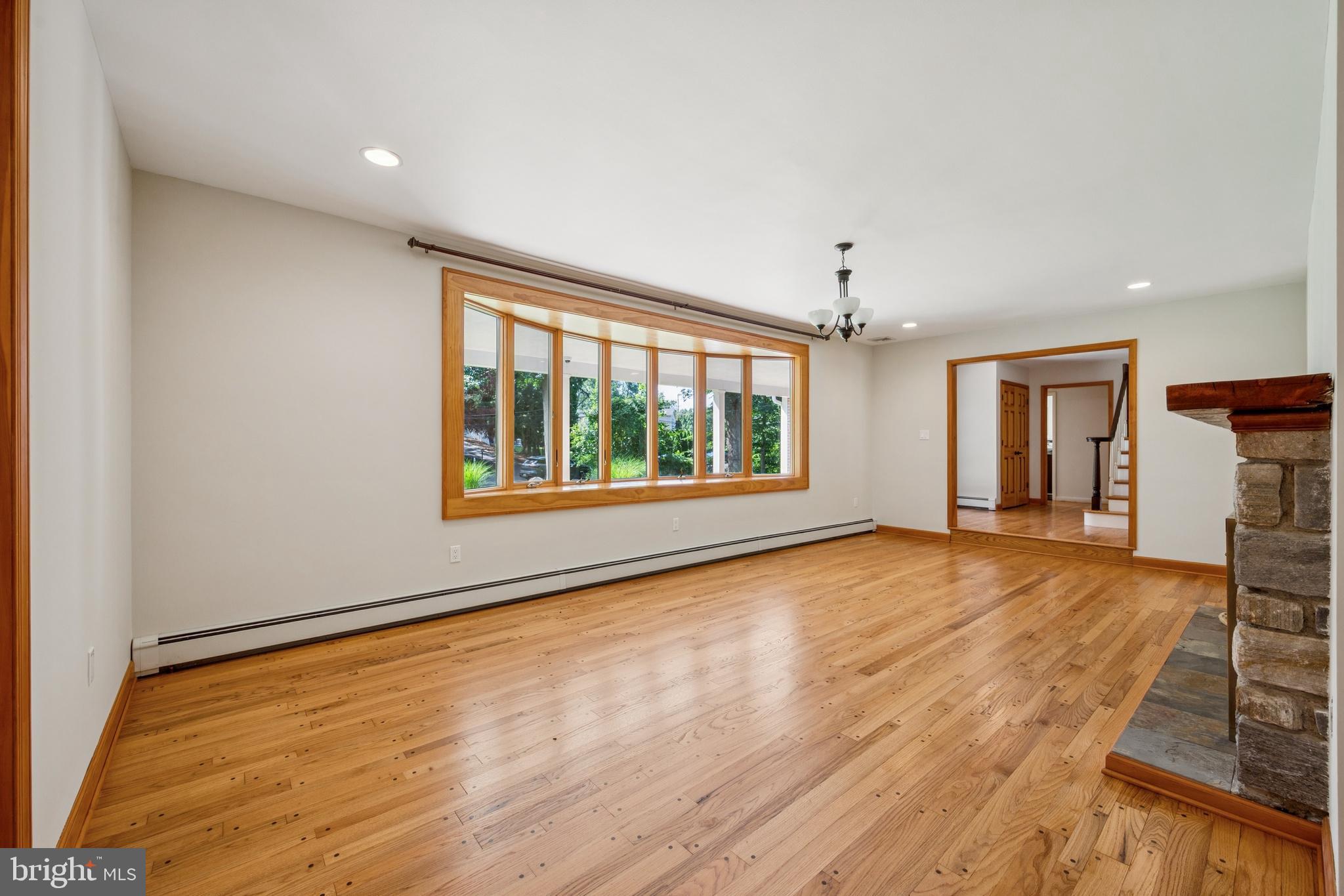3574 Glenway Road Huntingdon Valley, PA 19006 - Photo 12 of 60 a view of an empty room with a window and wooden floor