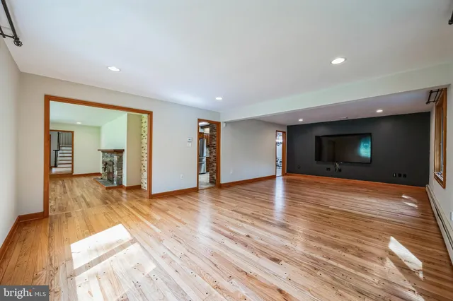 a kitchen with stainless steel appliances kitchen island granite countertop a stove a sink and a microwave