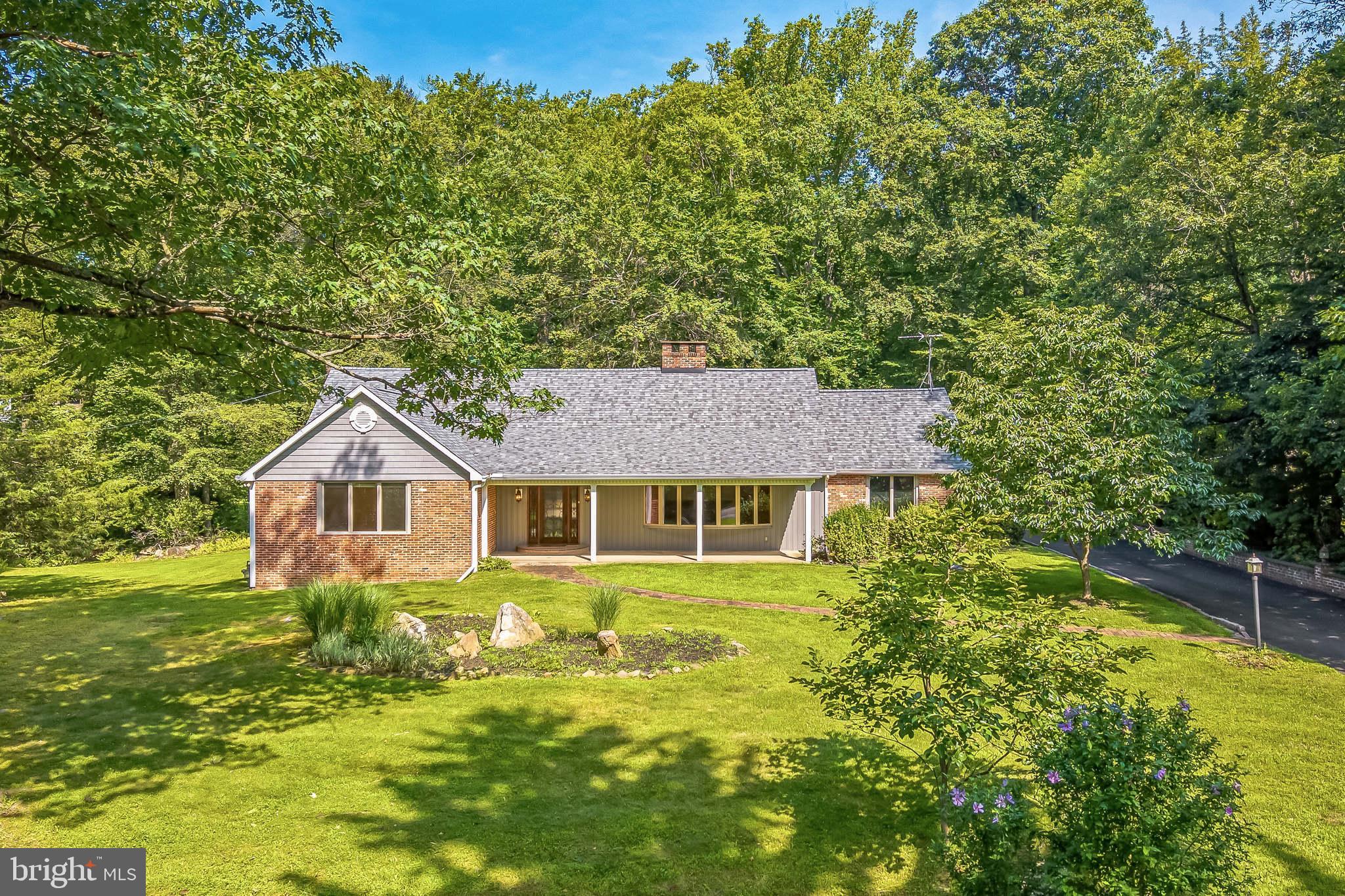 3574 Glenway Road Huntingdon Valley, PA 19006 - Photo 2 of 60 a view of a house with a big yard and large trees