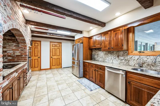 a dining room with furniture and a rug