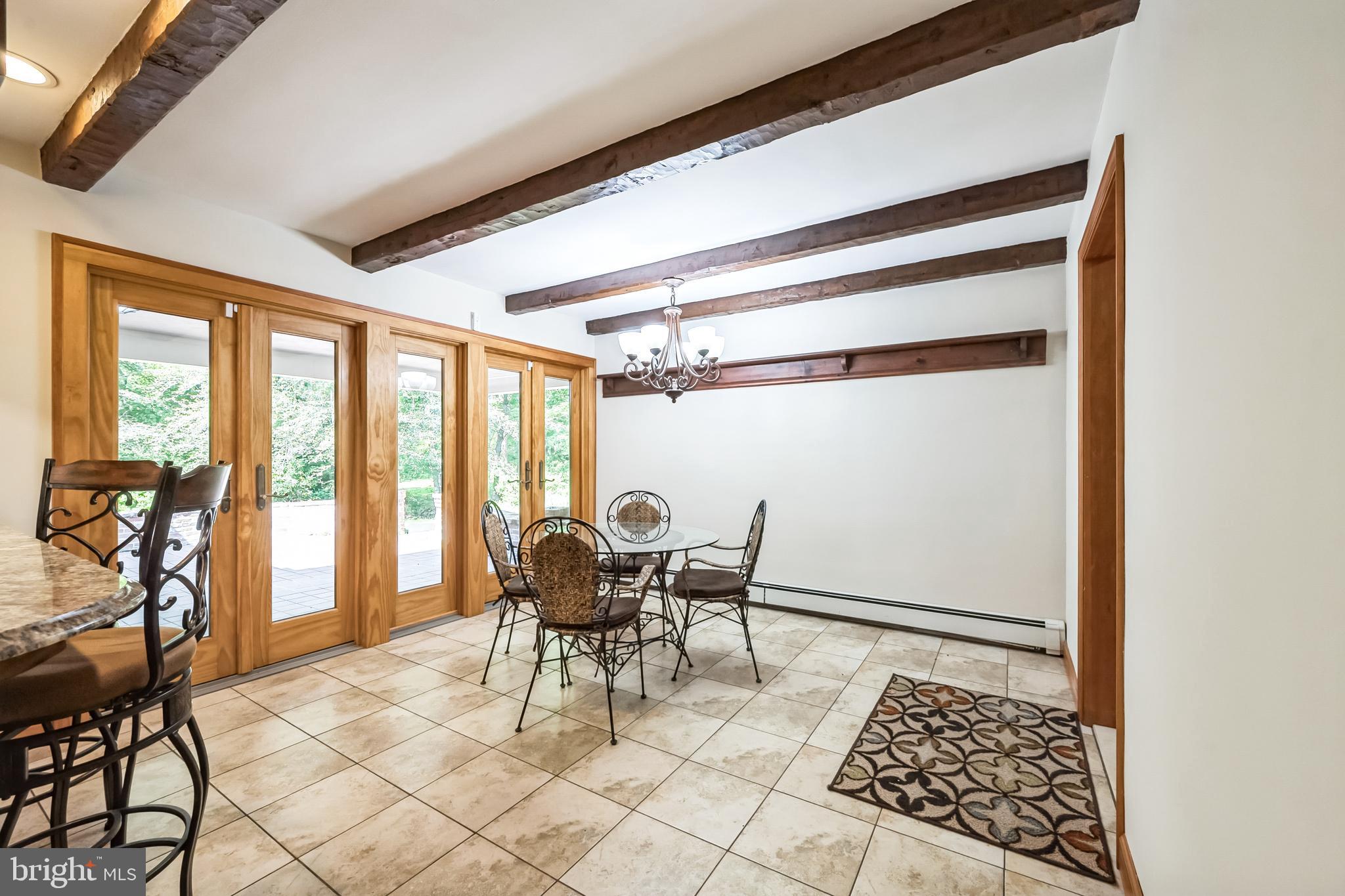 3574 Glenway Road Huntingdon Valley, PA 19006 - Photo 29 of 60 a dining room with furniture and a rug