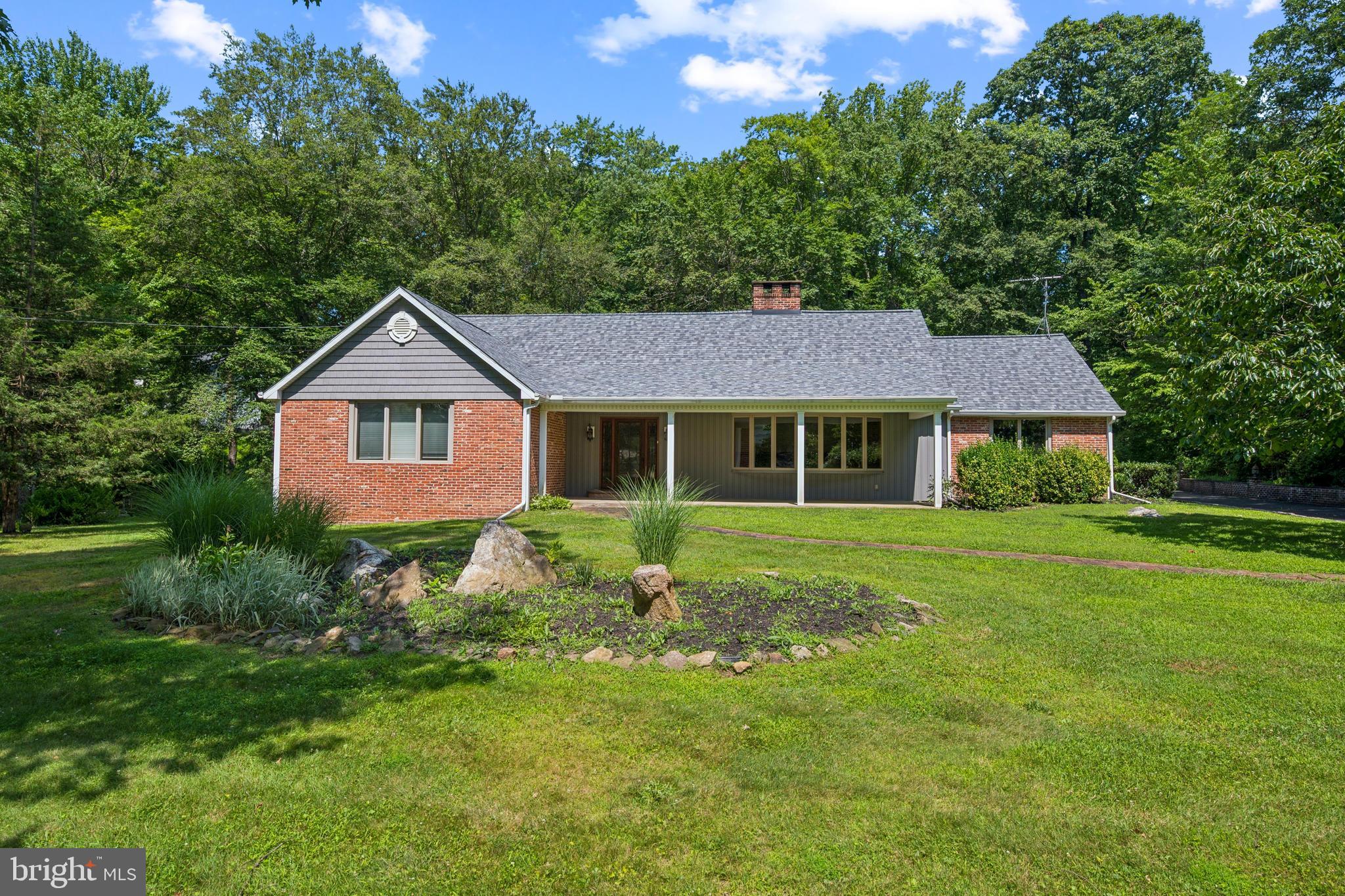 3574 Glenway Road Huntingdon Valley, PA 19006 - Photo 3 of 60 a front view of a house with a yard and trees