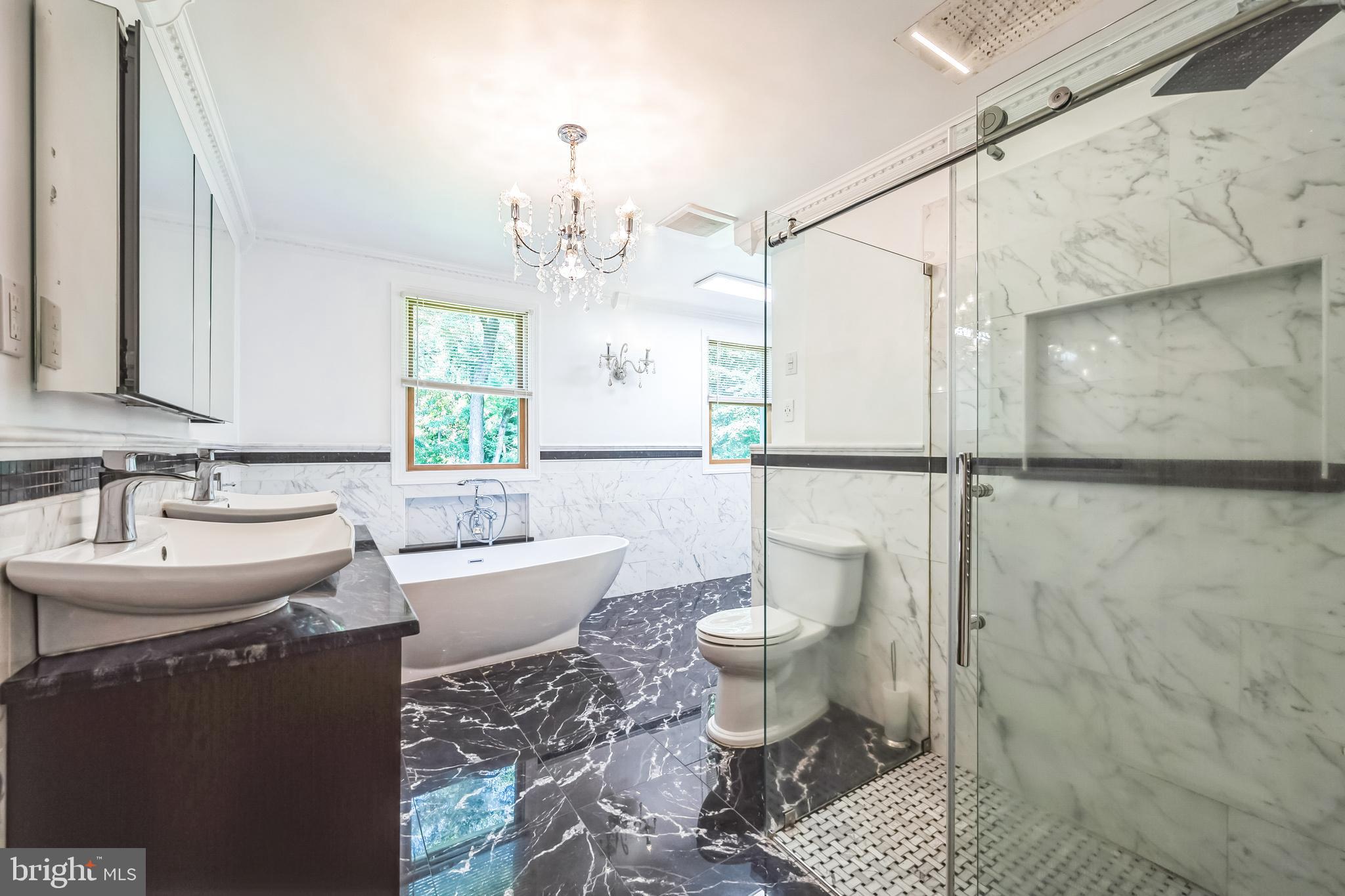 3574 Glenway Road Huntingdon Valley, PA 19006 - Photo 31 of 60 a bathroom with a sink toilet a mirror and shower