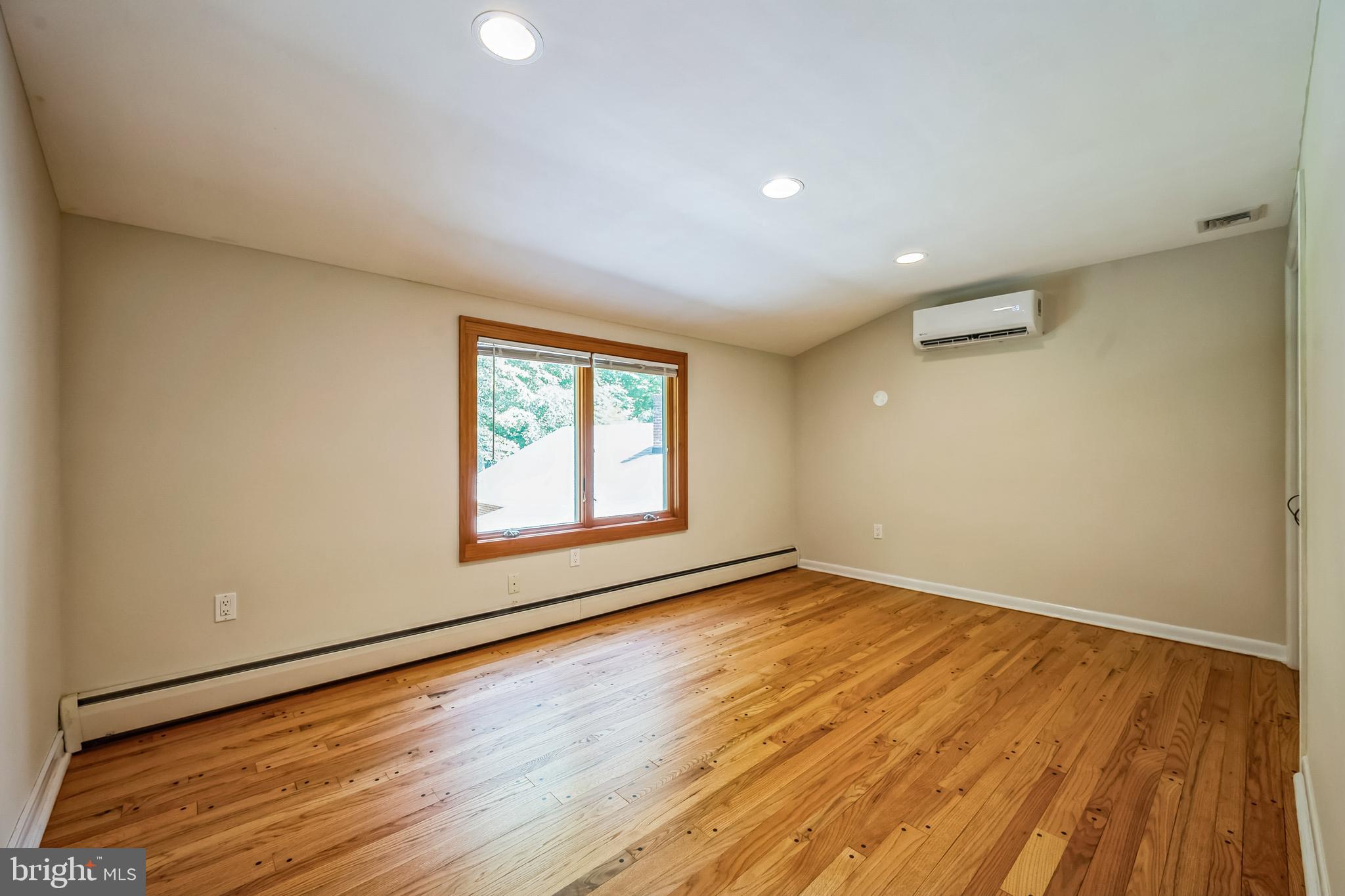 3574 Glenway Road Huntingdon Valley, PA 19006 - Photo 34 of 60 an empty room with wooden floor and windows