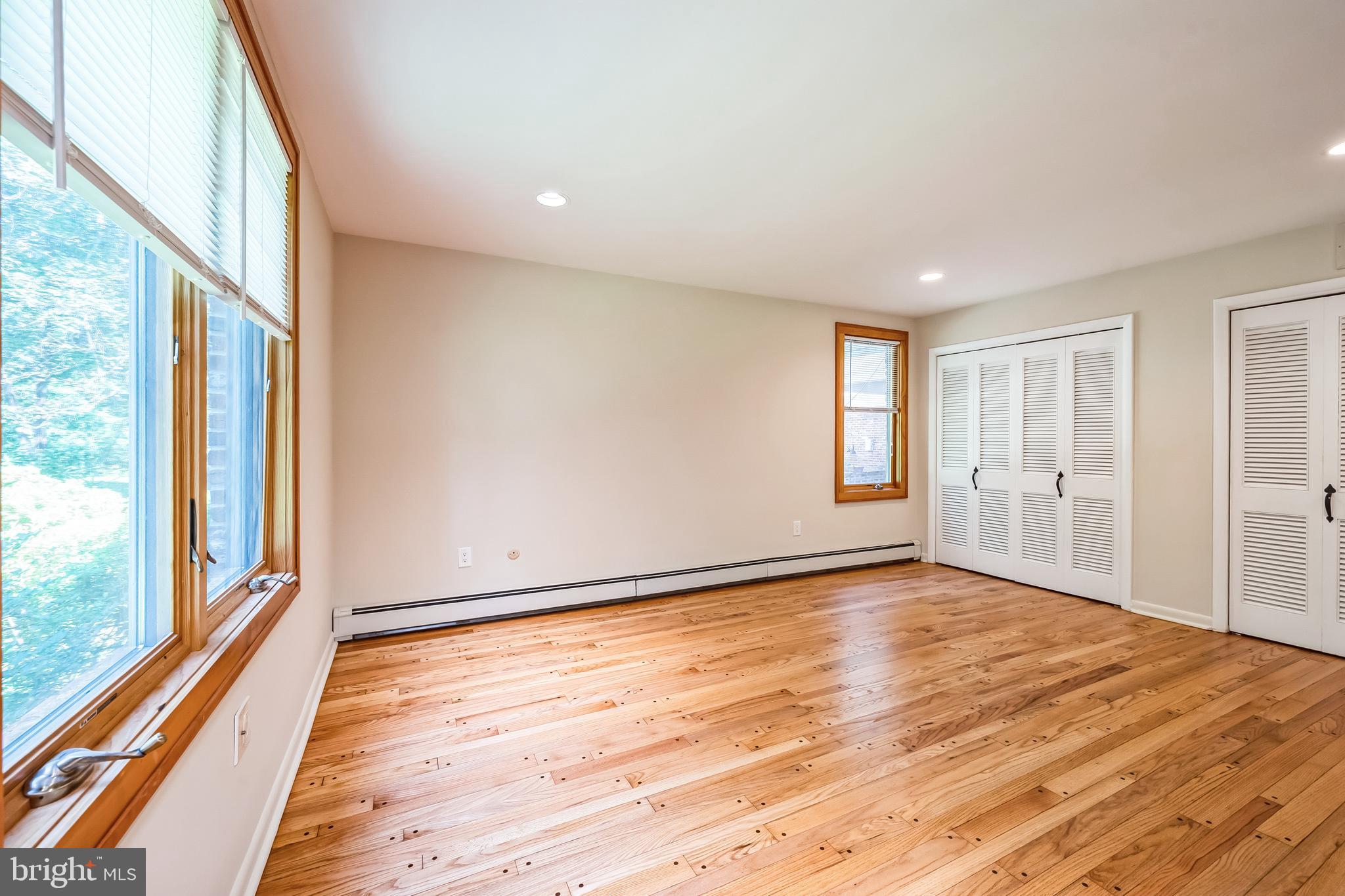 3574 Glenway Road Huntingdon Valley, PA 19006 - Photo 38 of 60 a view of an empty room with wooden floor and a window