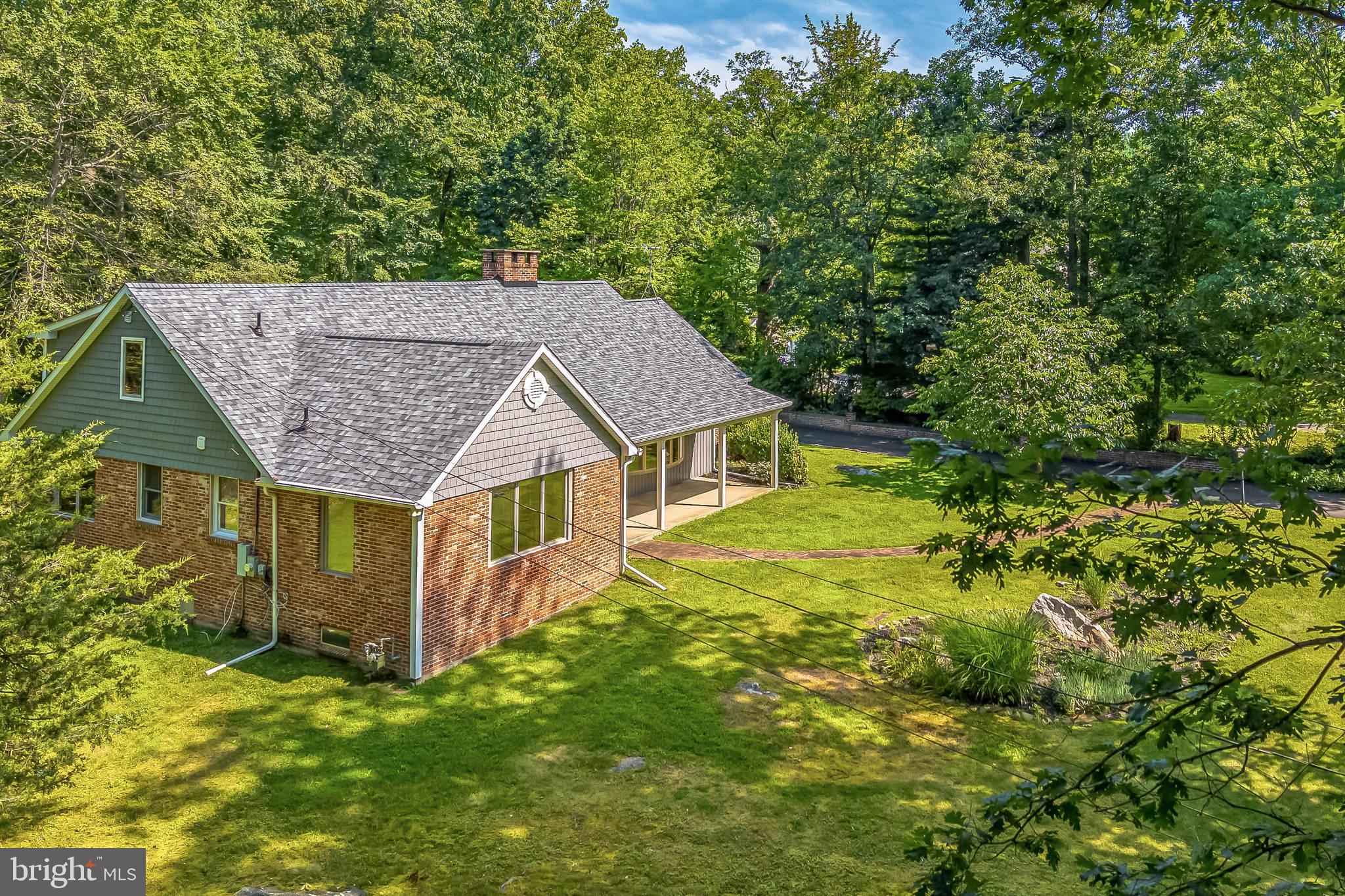 3574 Glenway Road Huntingdon Valley, PA 19006 - Photo 4 of 60 an aerial view of a house with a yard table and chairs