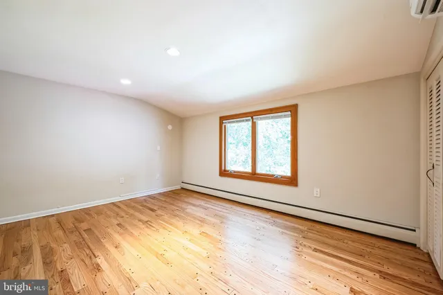 a view of a green field with lots of bushes
