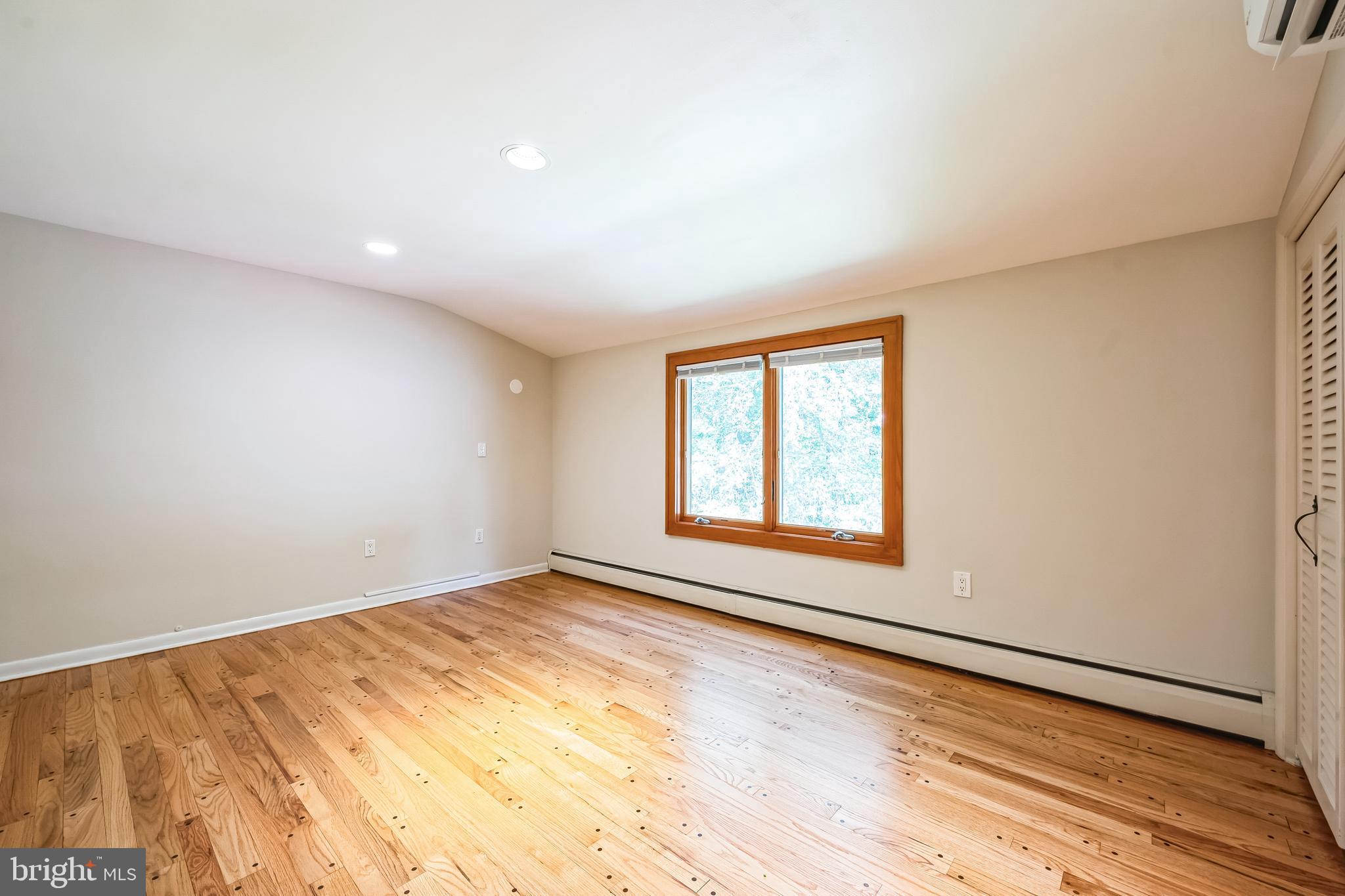 3574 Glenway Road Huntingdon Valley, PA 19006 - Photo 41 of 60 a view of an empty room with wooden floor and a window