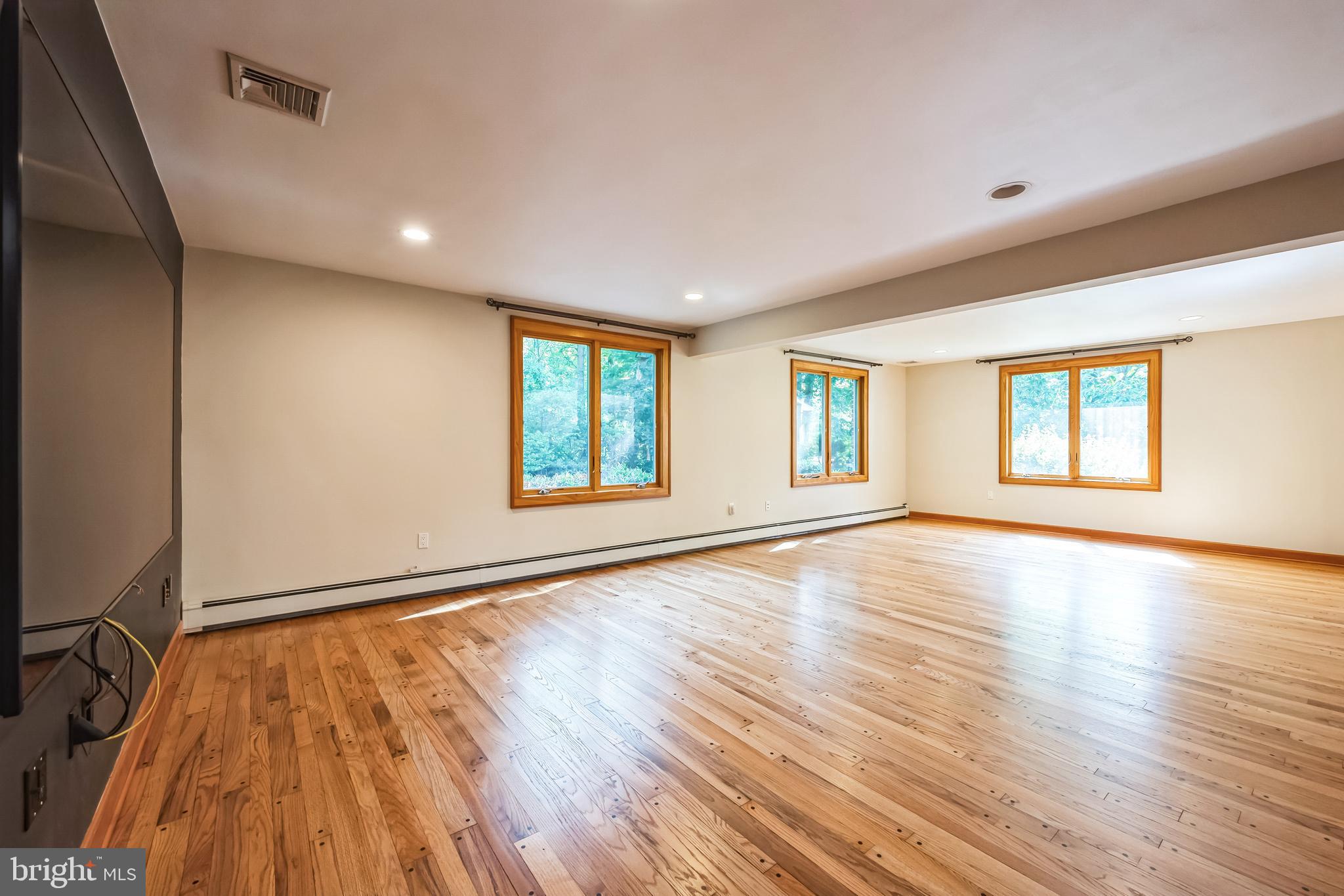 3574 Glenway Road Huntingdon Valley, PA 19006 - Photo 43 of 60 an empty room with wooden floor and windows