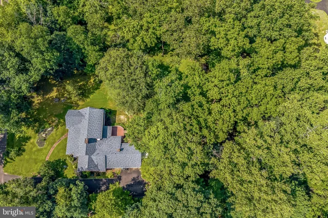 a view of house with backyard porch and glass door
