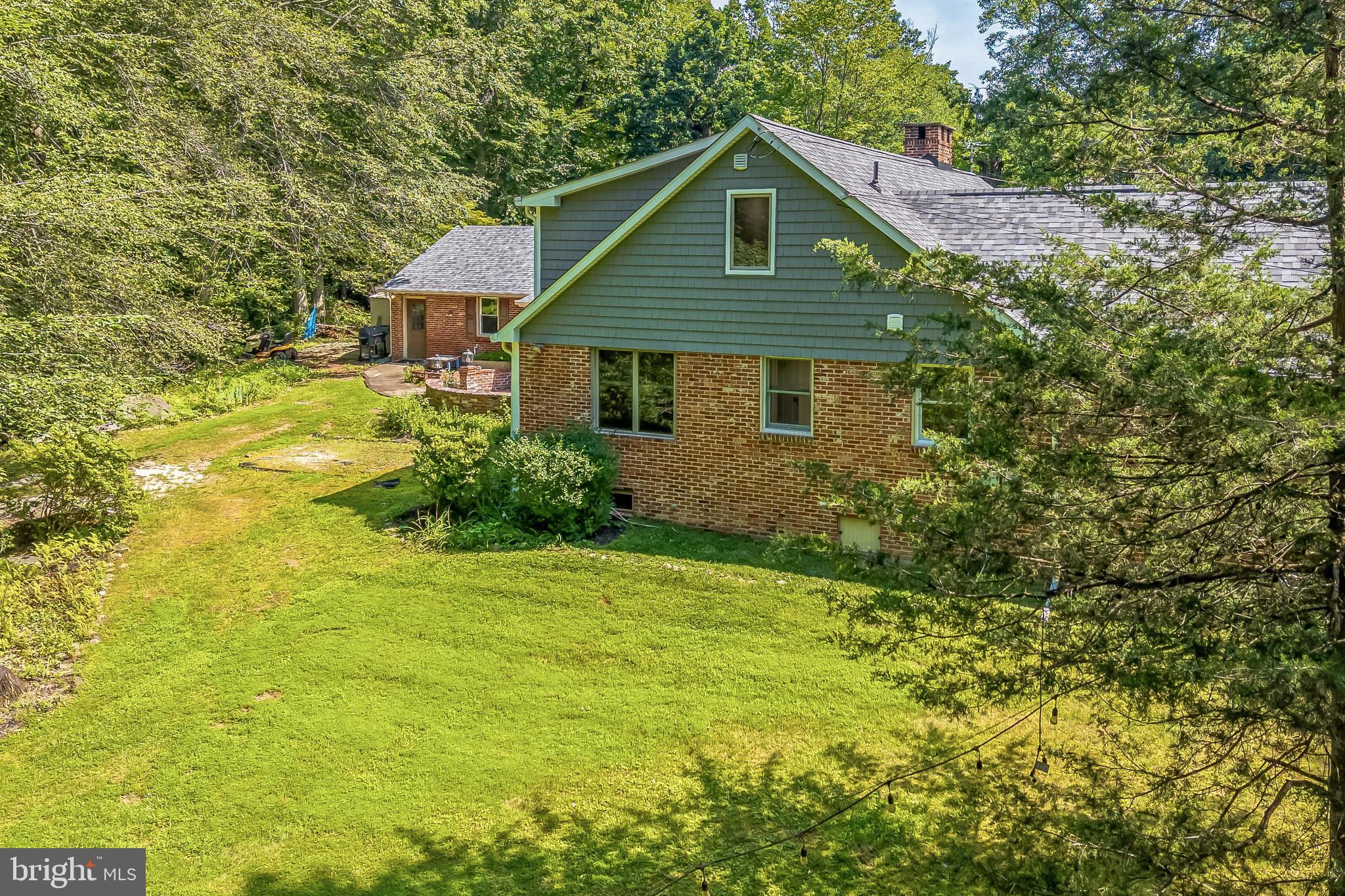3574 Glenway Road Huntingdon Valley, PA 19006 - Photo 47 of 60 a front view of house with yard and trees in the background