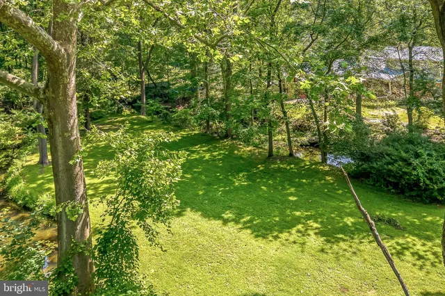 a view of outdoor space with deck and green space