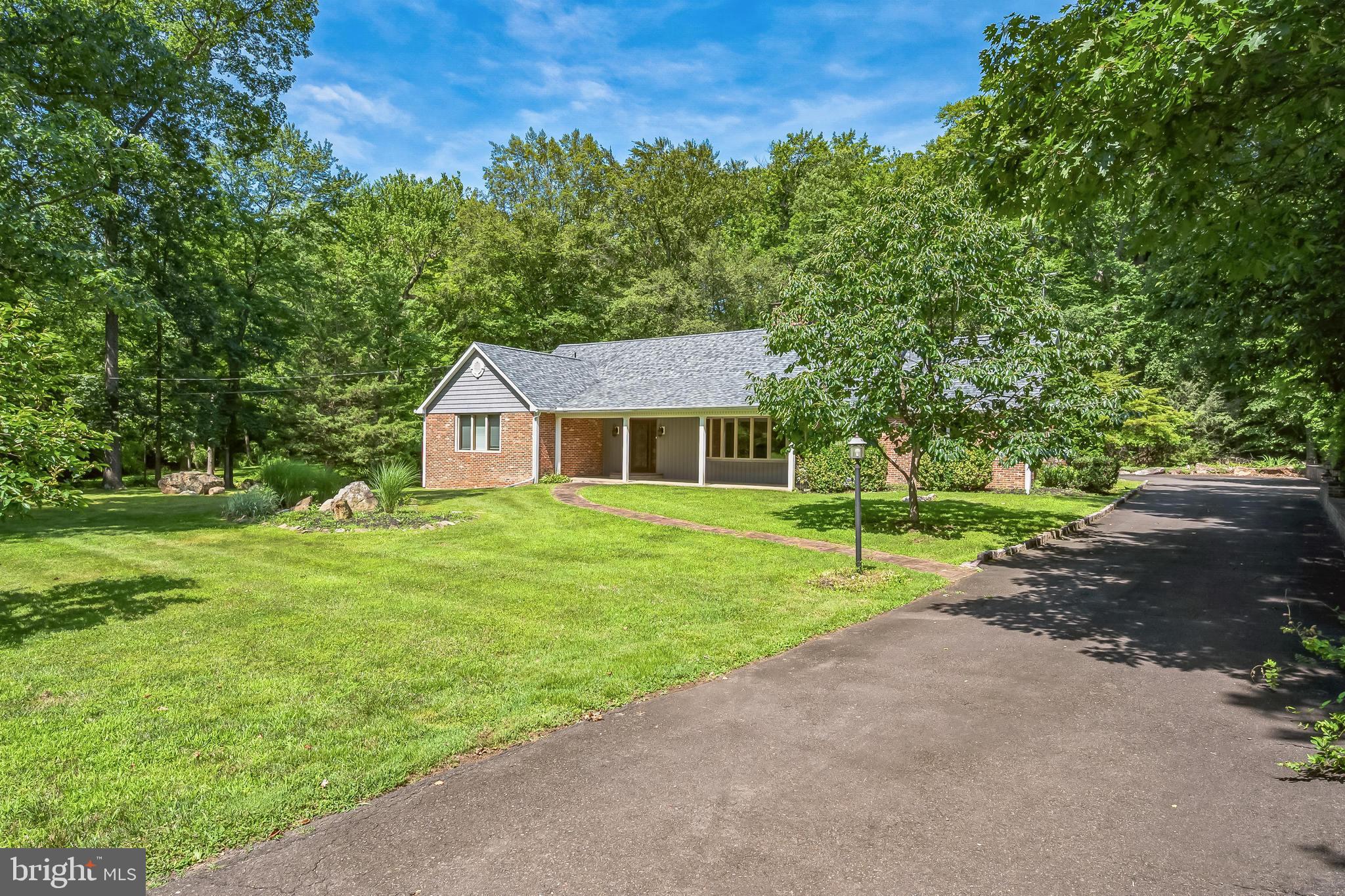3574 Glenway Road Huntingdon Valley, PA 19006 - Photo 50 of 60 a front view of a house with a yard and trees