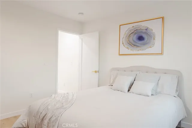 a view of a livingroom with furniture and a hallway