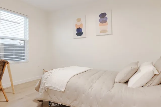 a bedroom with a bed and a table