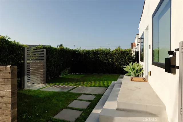 a kitchen with sink refrigerator dining table and chairs