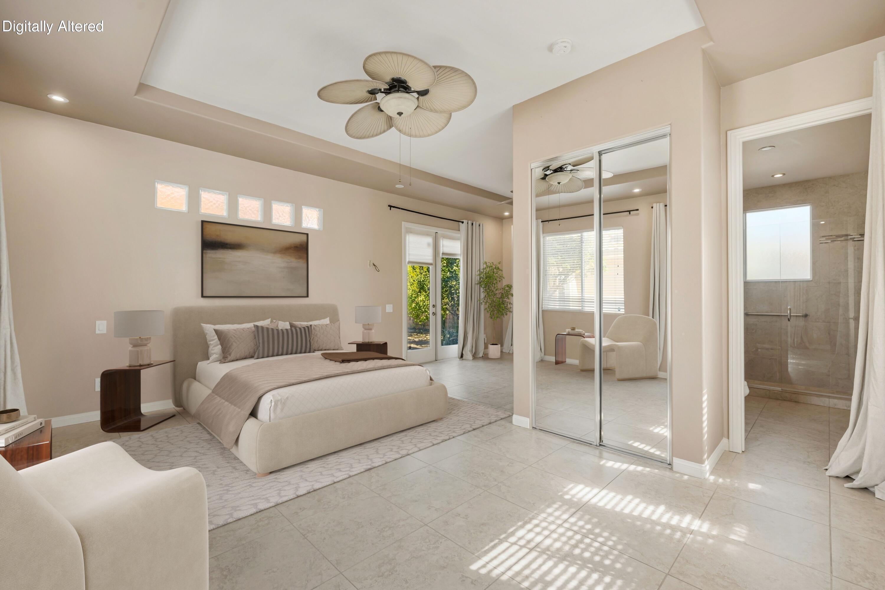 4 Ivy League Circle Rancho Mirage, CA 92270 - Photo 42 of 71 a bedroom with a large bed and a chandelier