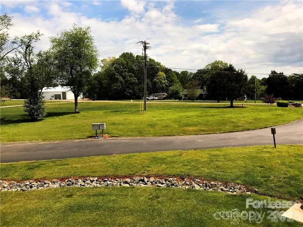 a view of a golf course with a house