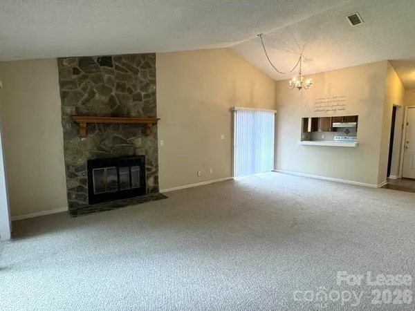 a view of a room with a fireplace