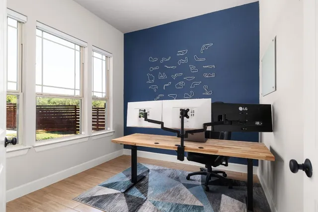 a view of a workspace with a window and sitting area