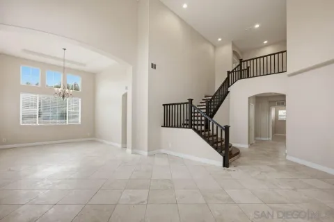 a view of entryway and hall with a front door