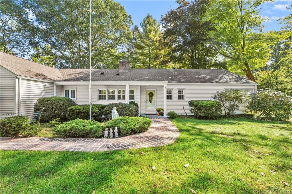 265 Pepper Ridge Road Stamford, CT 06905 - Photo 1 of 1 a front view of a house with a yard