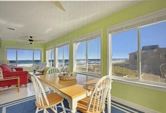 a dining room with furniture a window and a kitchen view