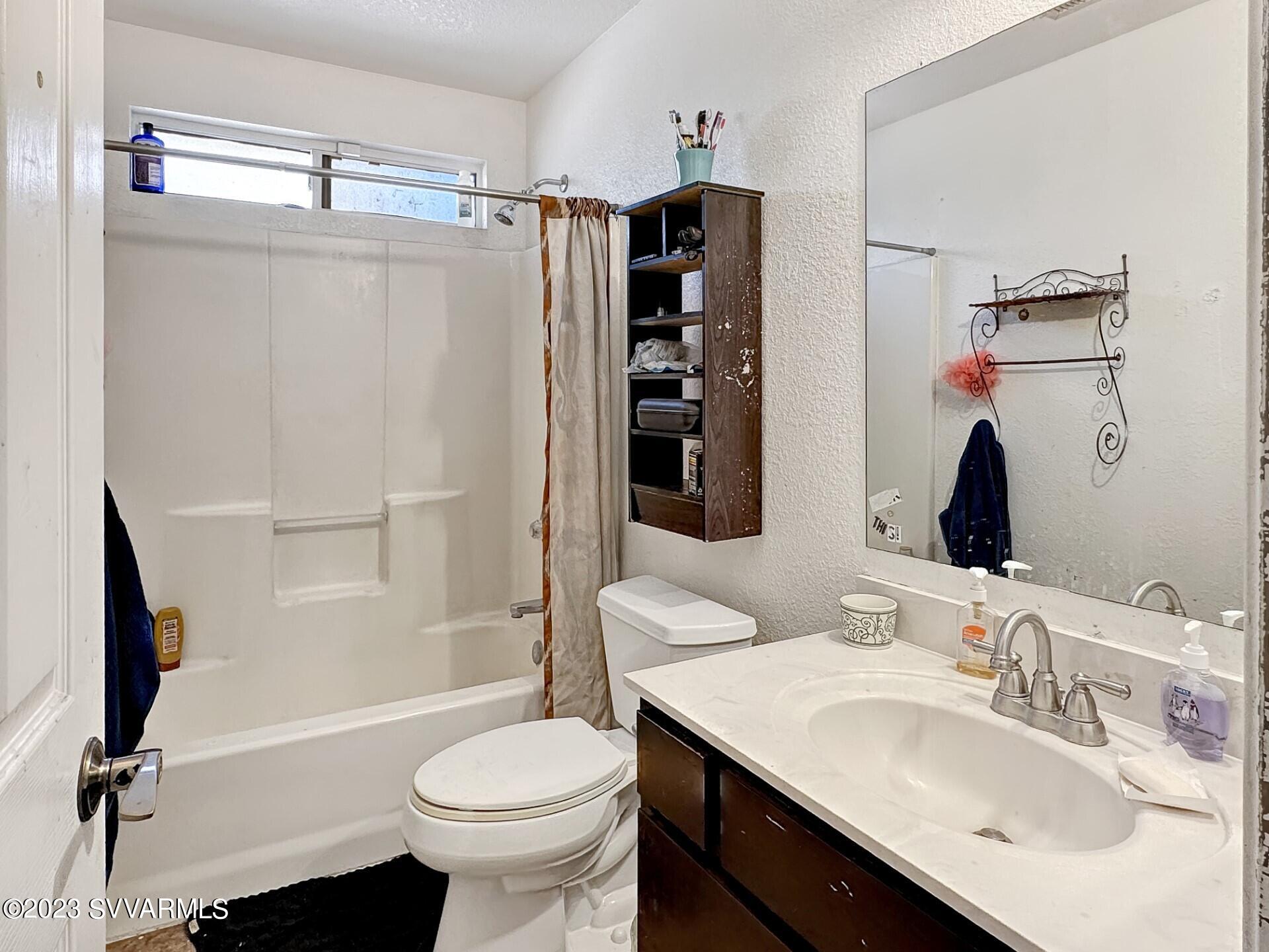 4510 East Steven Rimrock, AZ 86335 - Photo 4 of 9 a bathroom with a sink toilet and shower