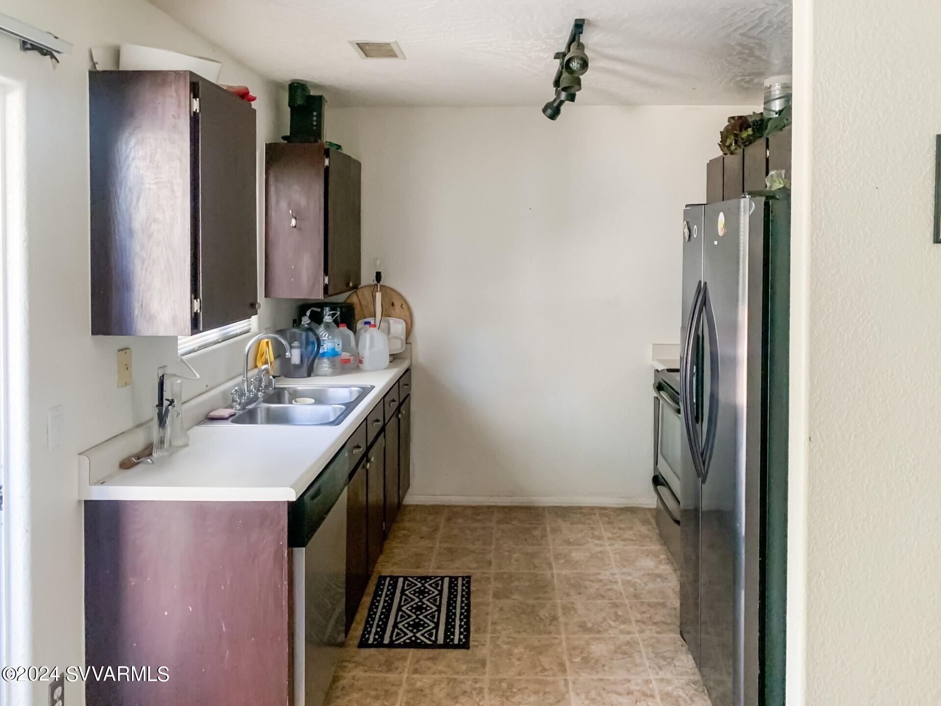 4510 East Steven Rimrock, AZ 86335 - Photo 5 of 9 a bathroom with a sink and a mirror