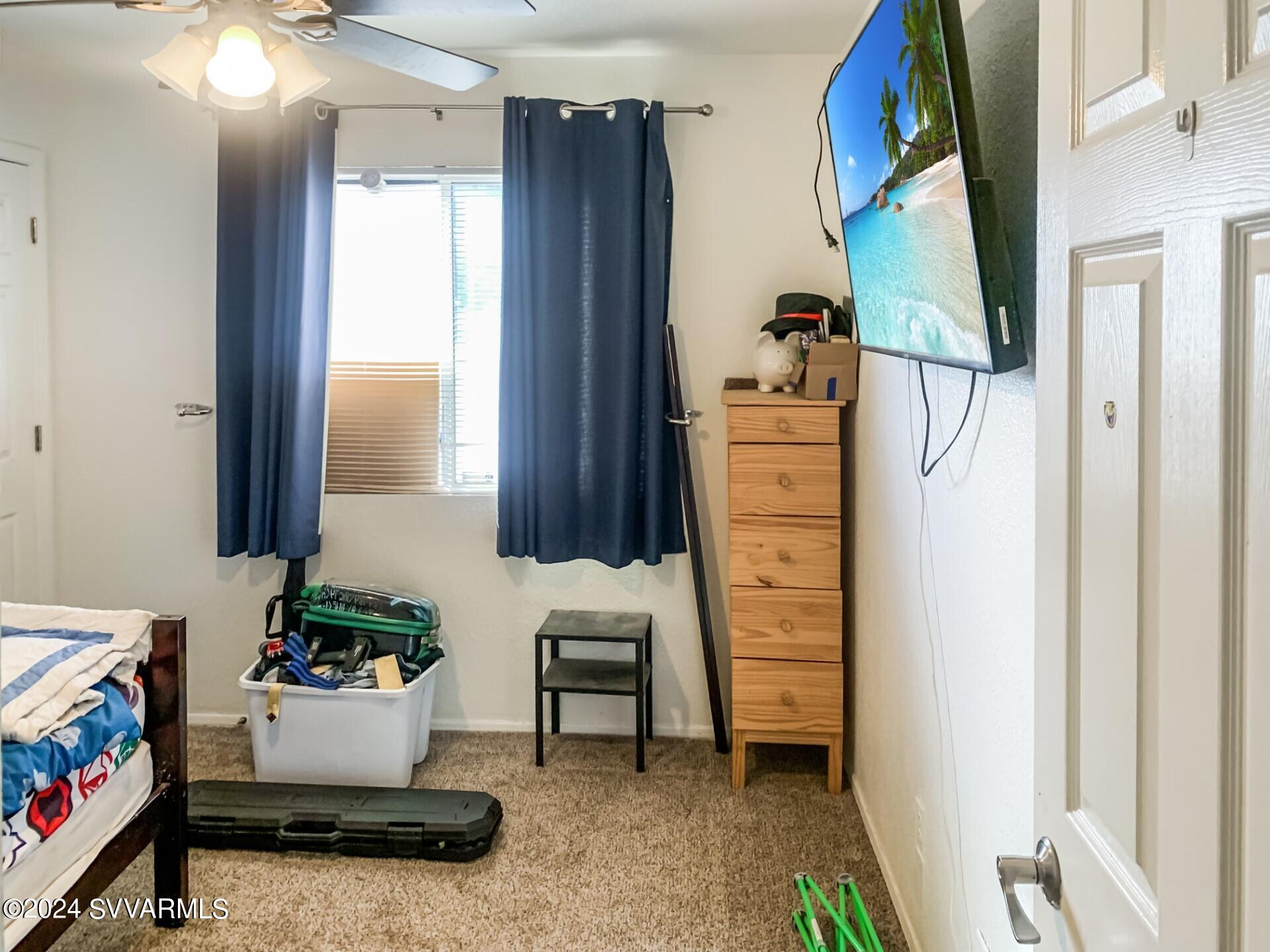 4510 East Steven Rimrock, AZ 86335 - Photo 6 of 9 a bedroom with a bed and a window