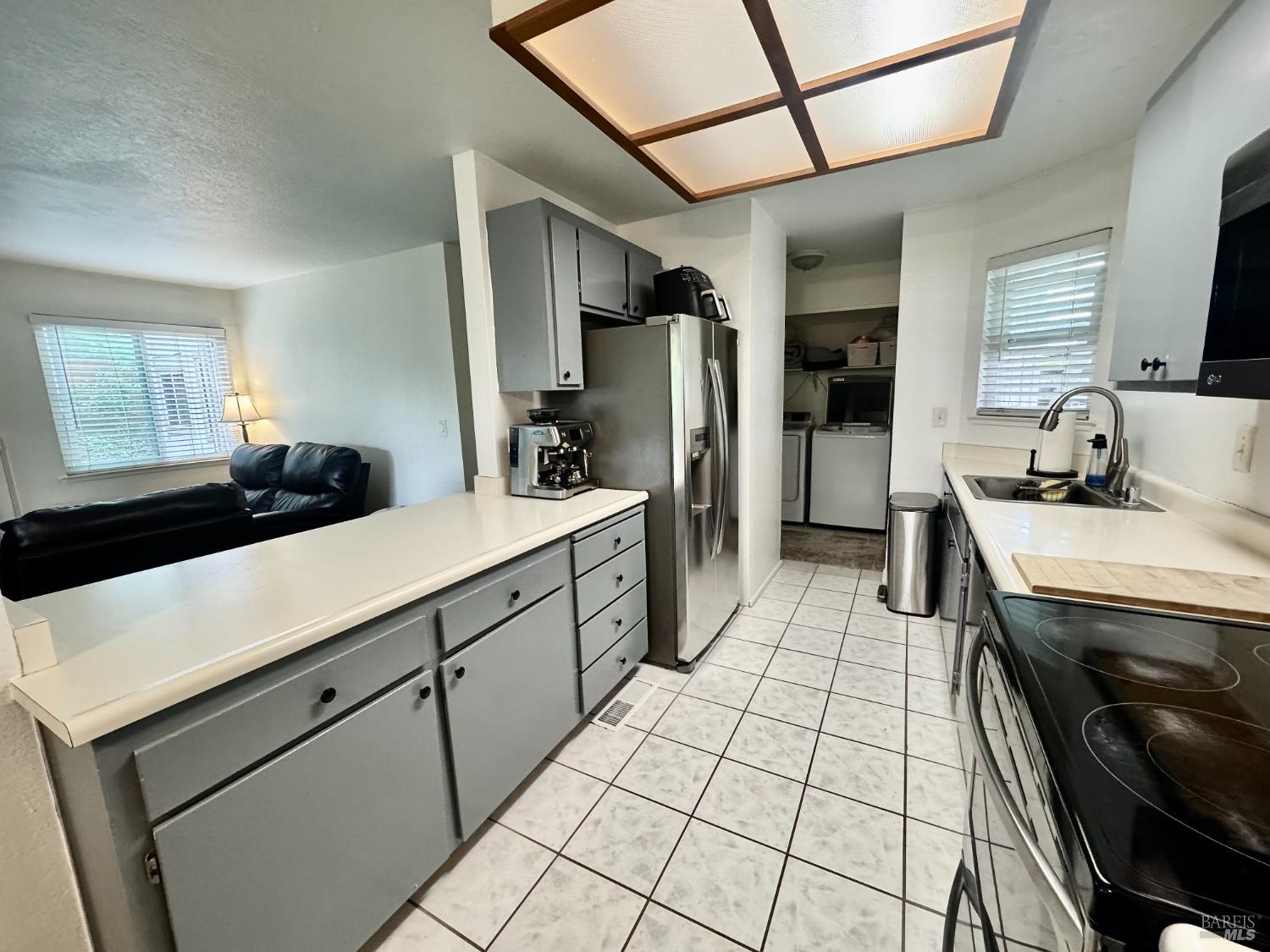 2528 Westberry Drive Santa Rosa, CA 95403 - Photo 14 of 37 a kitchen with stainless steel appliances a sink stove and cabinets