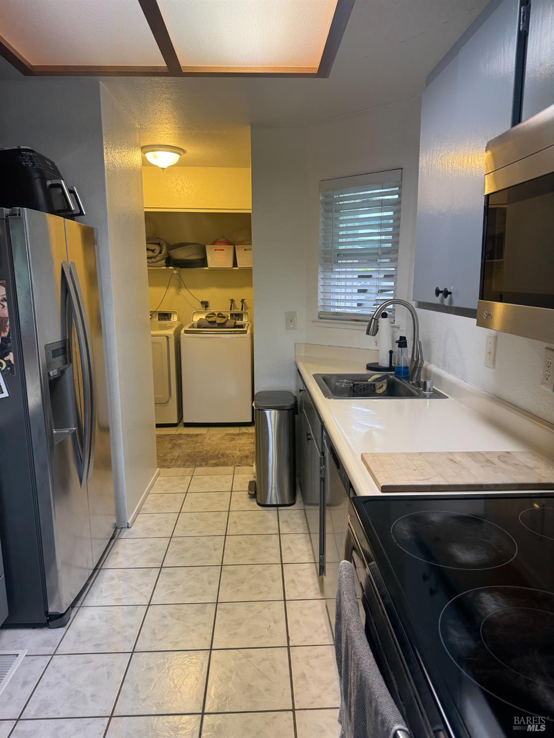 2528 Westberry Drive Santa Rosa, CA 95403 - Photo 15 of 37 a kitchen with a sink appliances and cabinets