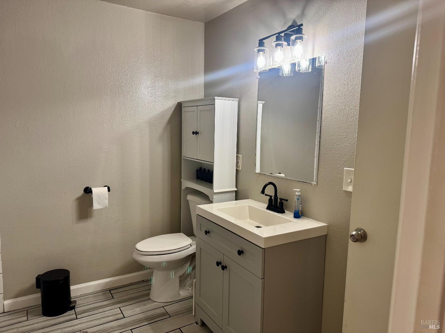 2528 Westberry Drive Santa Rosa, CA 95403 - Photo 25 of 37 a bathroom with a sink a toilet and mirror