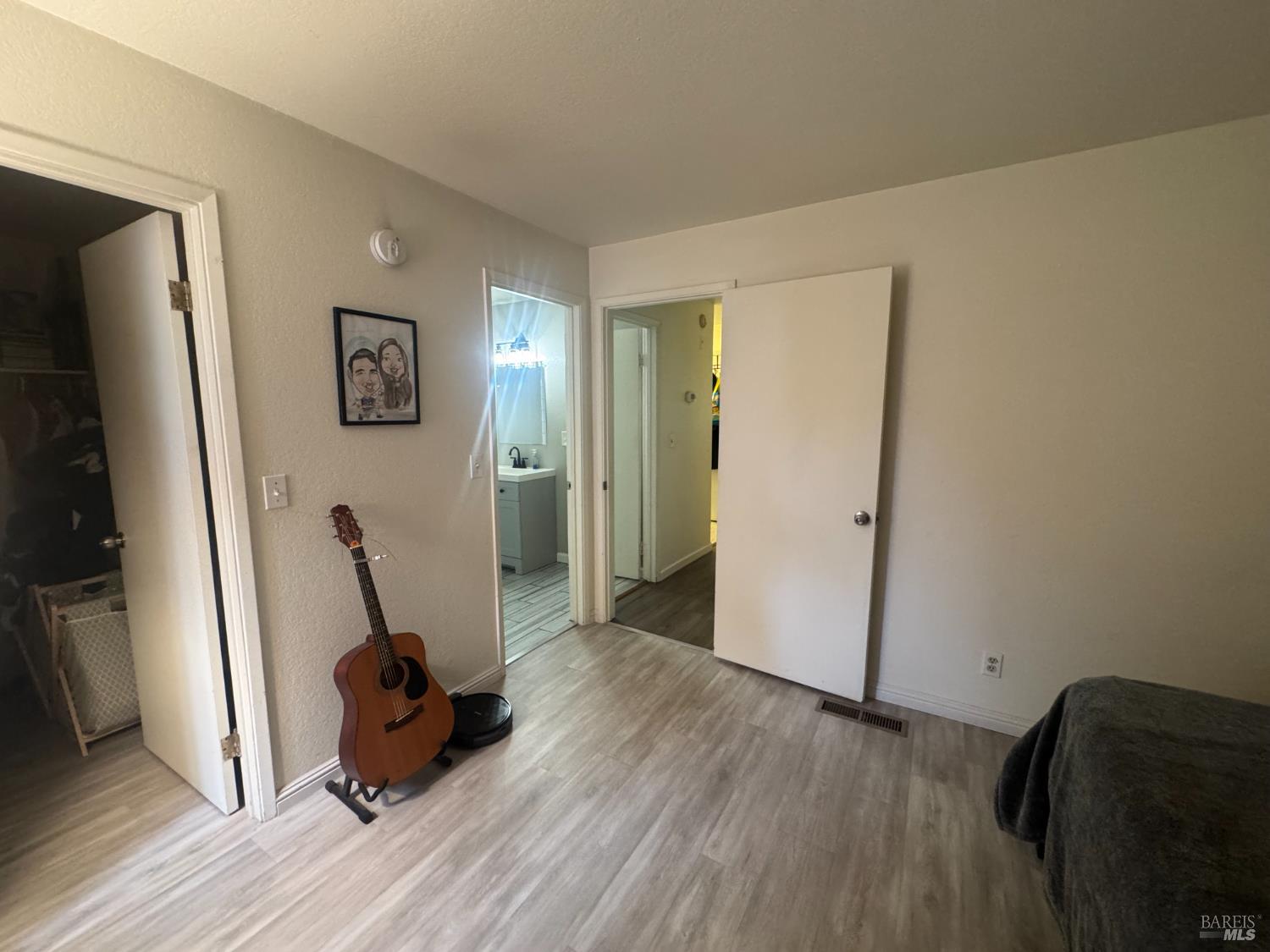 2528 Westberry Drive Santa Rosa, CA 95403 - Photo 26 of 37 a view of a hallway with wooden floor and a workspace