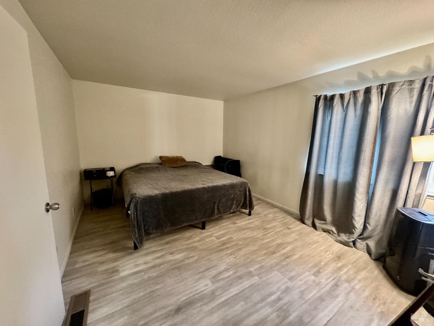 2528 Westberry Drive Santa Rosa, CA 95403 - Photo 27 of 37 a bedroom with a bed and a mirror