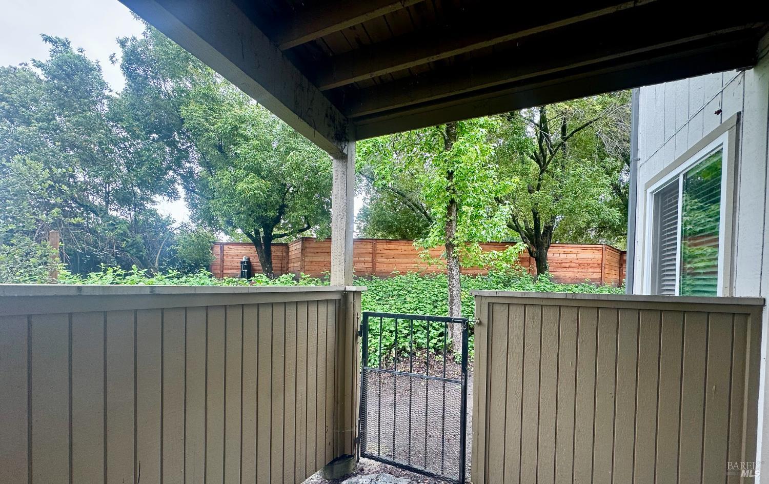 2528 Westberry Drive Santa Rosa, CA 95403 - Photo 9 of 37 a view of a house with a large window and wooden fence
