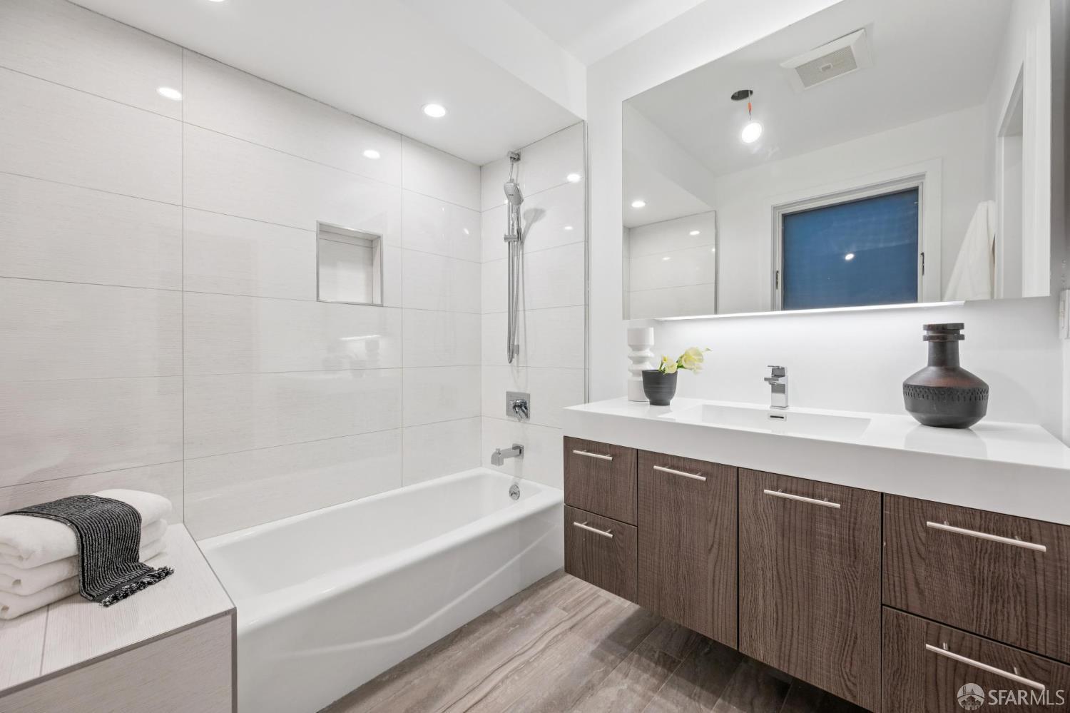 439 Clipper Street San Francisco, CA 94114 - Photo 42 of 71 a bathroom with a tub sink and mirror
