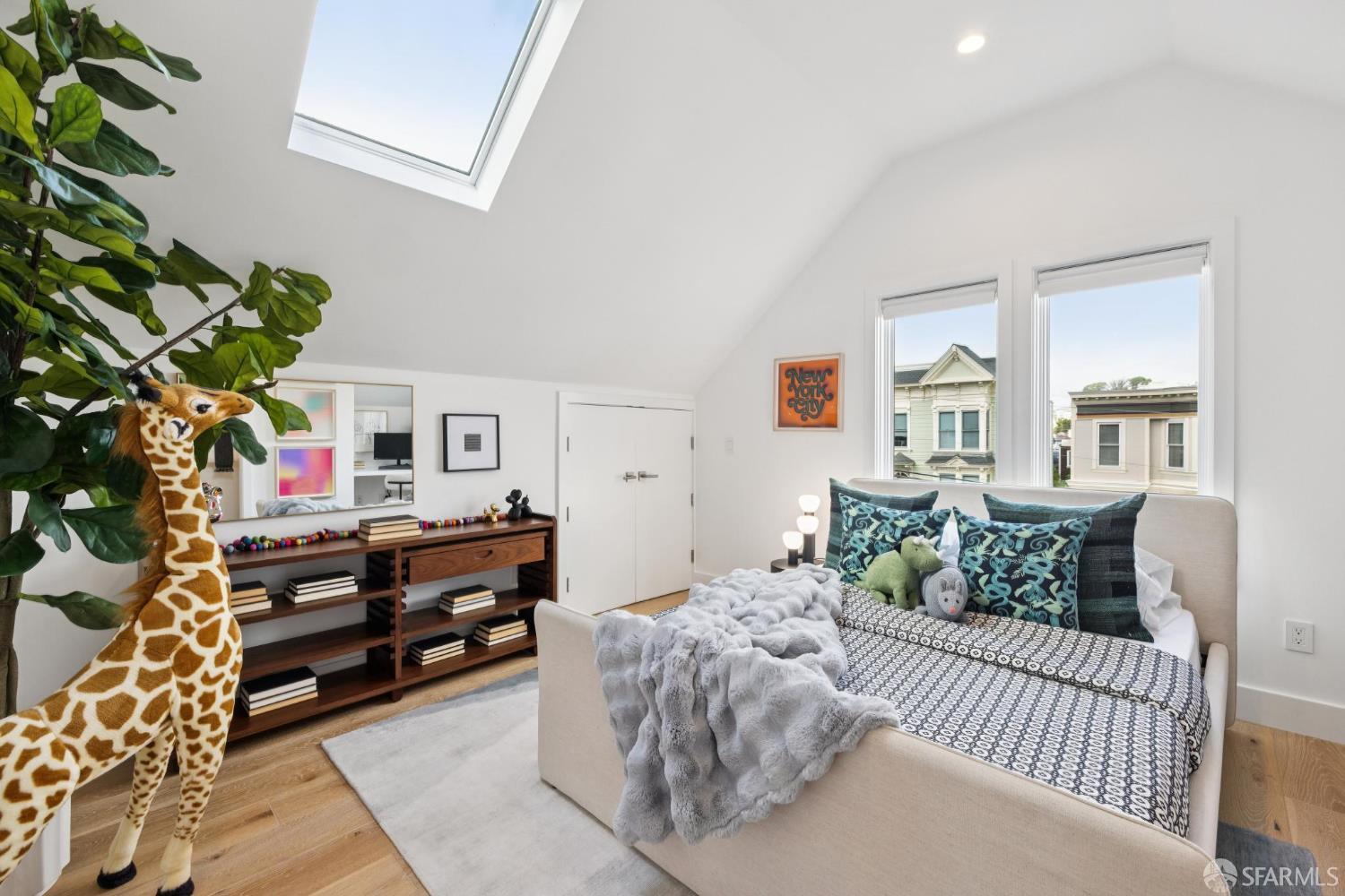 439 Clipper Street San Francisco, CA 94114 - Photo 46 of 71 a bedroom with furniture a fireplace and a potted plant