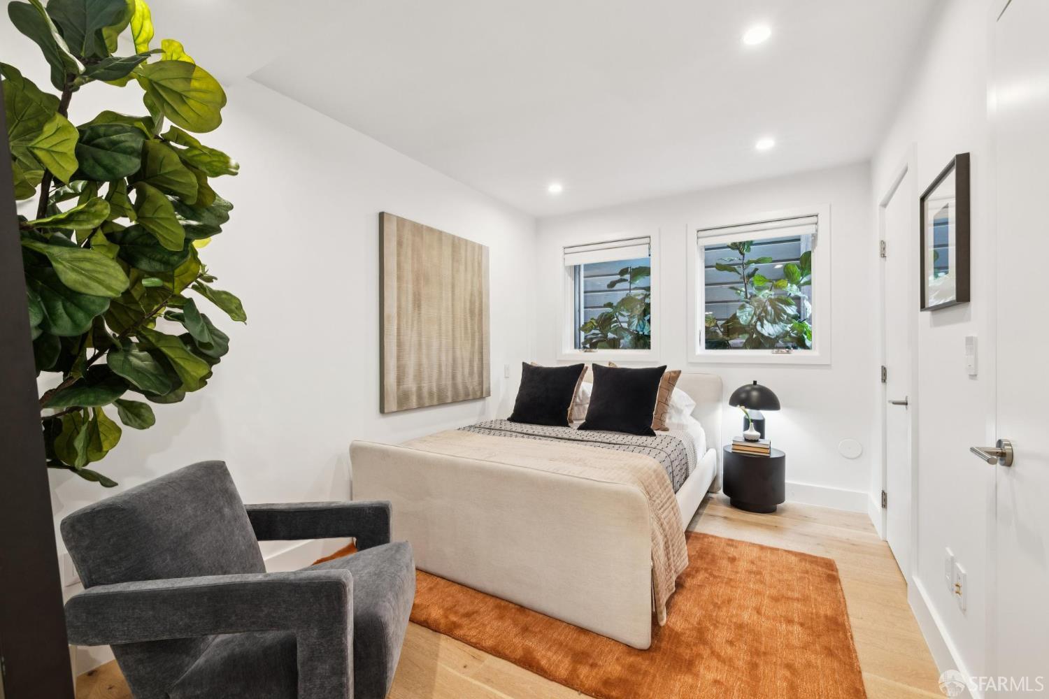 439 Clipper Street San Francisco, CA 94114 - Photo 52 of 71 a bedroom with a bed and a couch