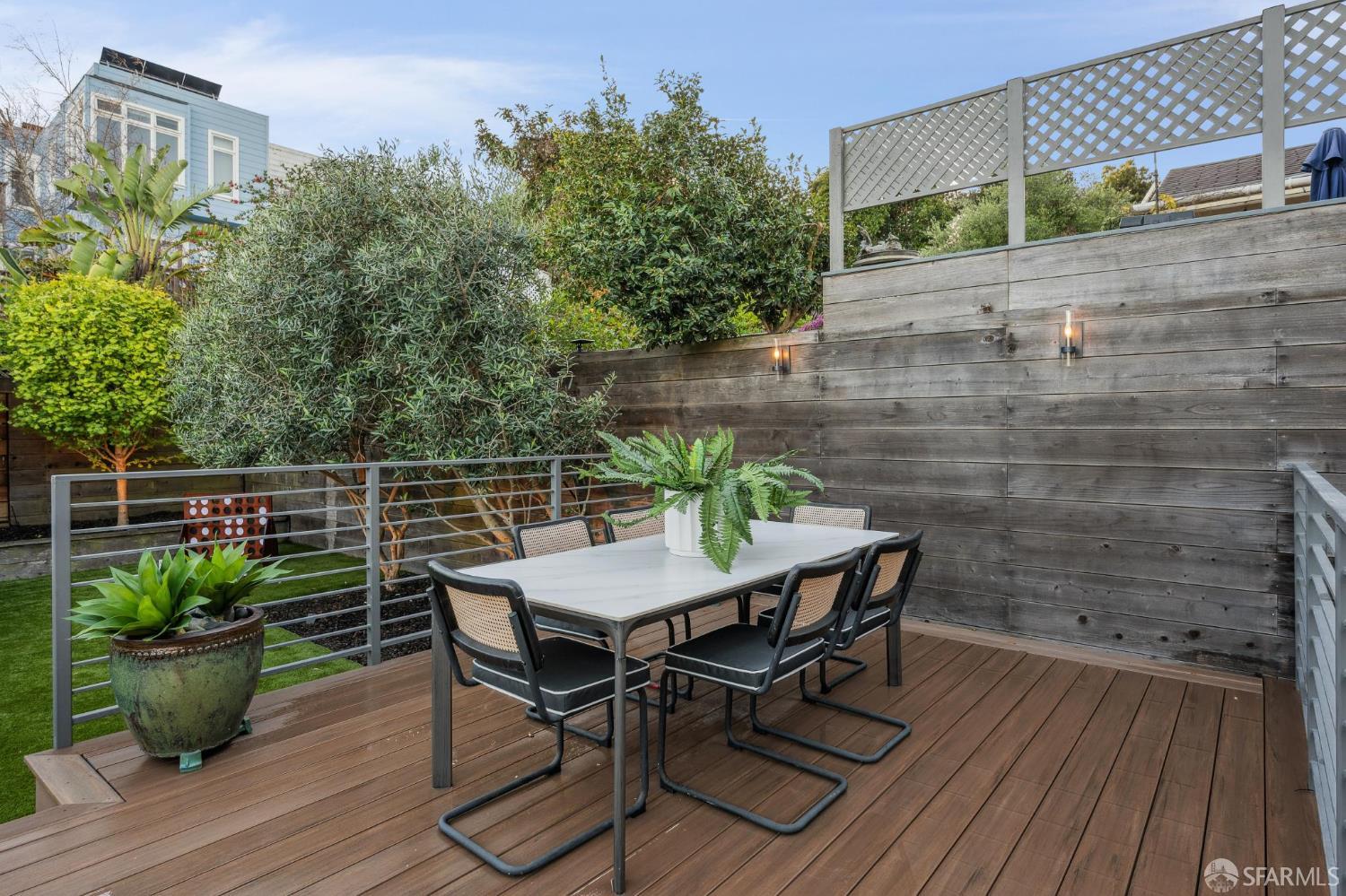 439 Clipper Street San Francisco, CA 94114 - Photo 66 of 71 a balcony with wooden floor table and chairs