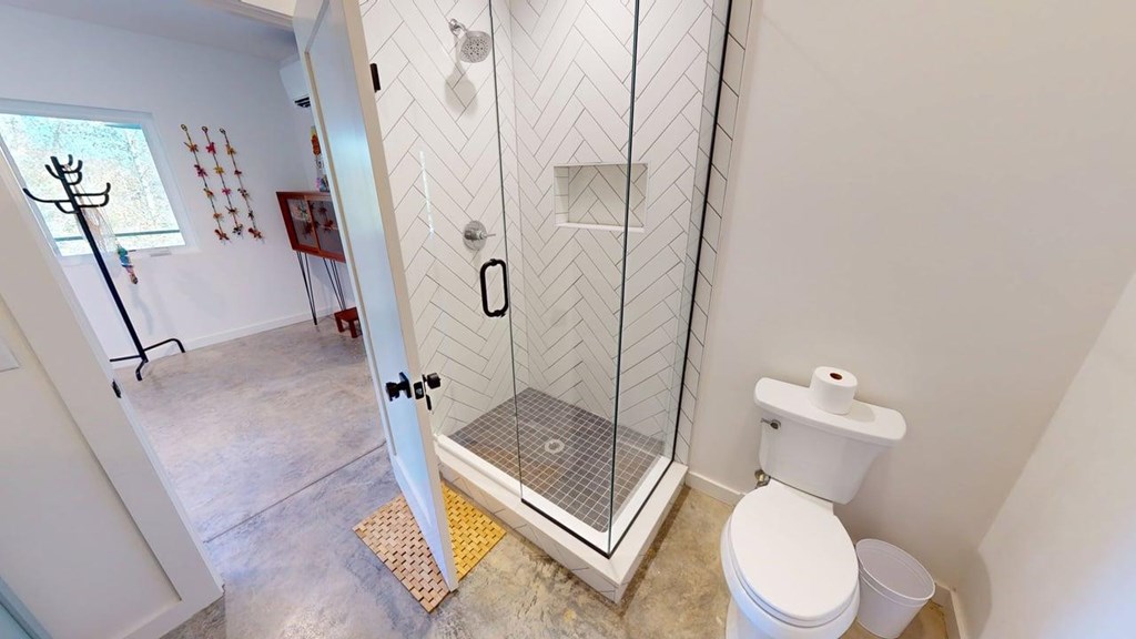 458 Brannon Ridge Young Harris, GA 30582 - Photo 16 of 33 a white toilet sitting next to a bathroom sink