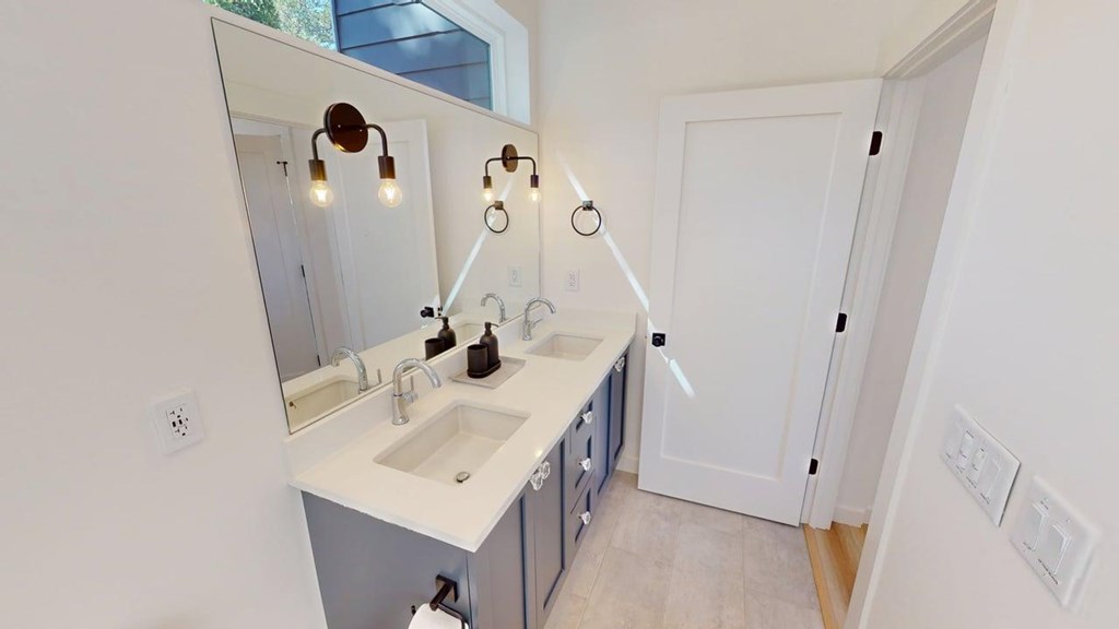 458 Brannon Ridge Young Harris, GA 30582 - Photo 19 of 33 a bathroom with a sink a mirror and vanity