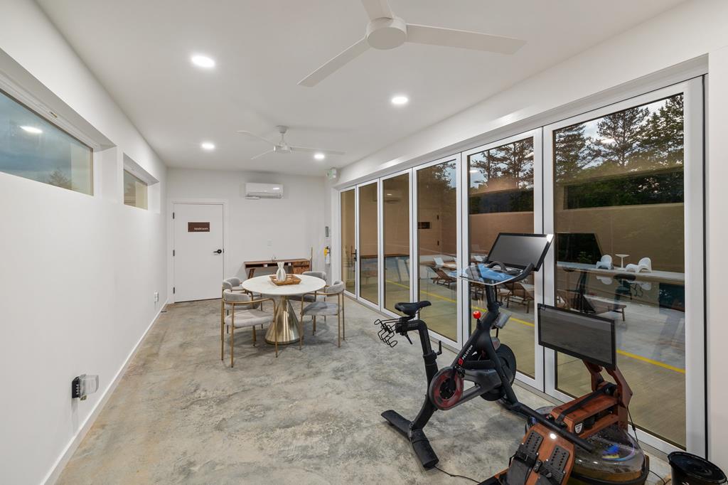 458 Brannon Ridge Young Harris, GA 30582 - Photo 32 of 33 a view of workspace with wooden floor windows and a table
