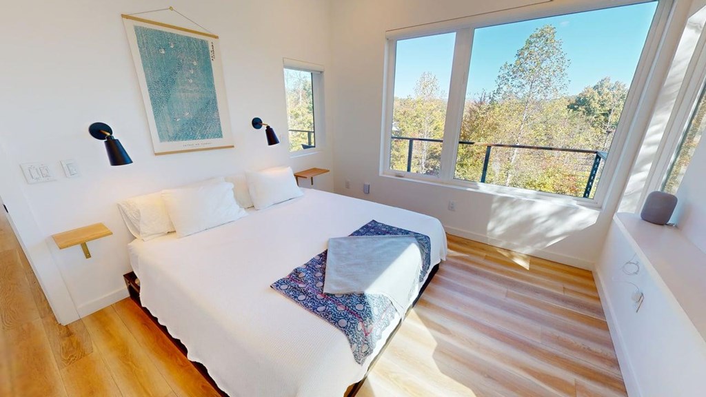 458 Brannon Ridge Young Harris, GA 30582 - Photo 5 of 33 a living room with a bed and a large window