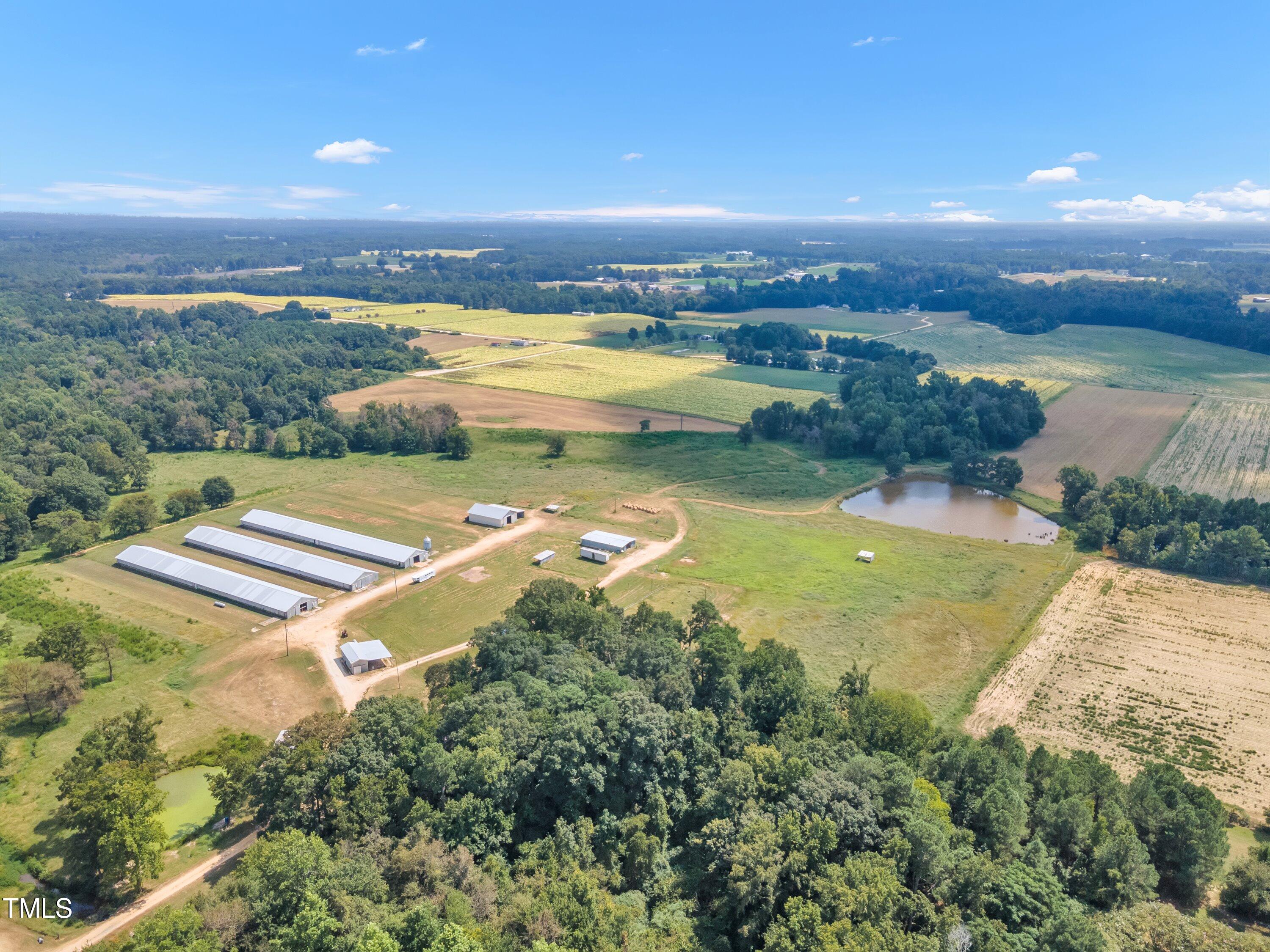 8585 Stricklands Crossroads Road Four Oaks, NC 27524 - Photo 11 of 30 an aerial view of residential houses with outdoor space and ocean view