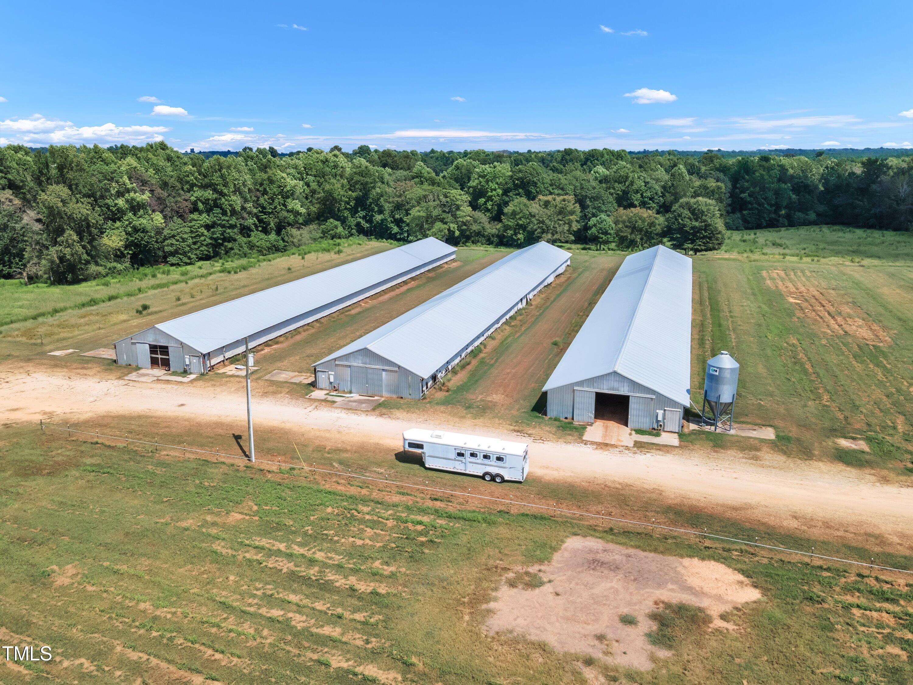 8585 Stricklands Crossroads Road Four Oaks, NC 27524 - Photo 20 of 30 a view of a big yard with an ocean view