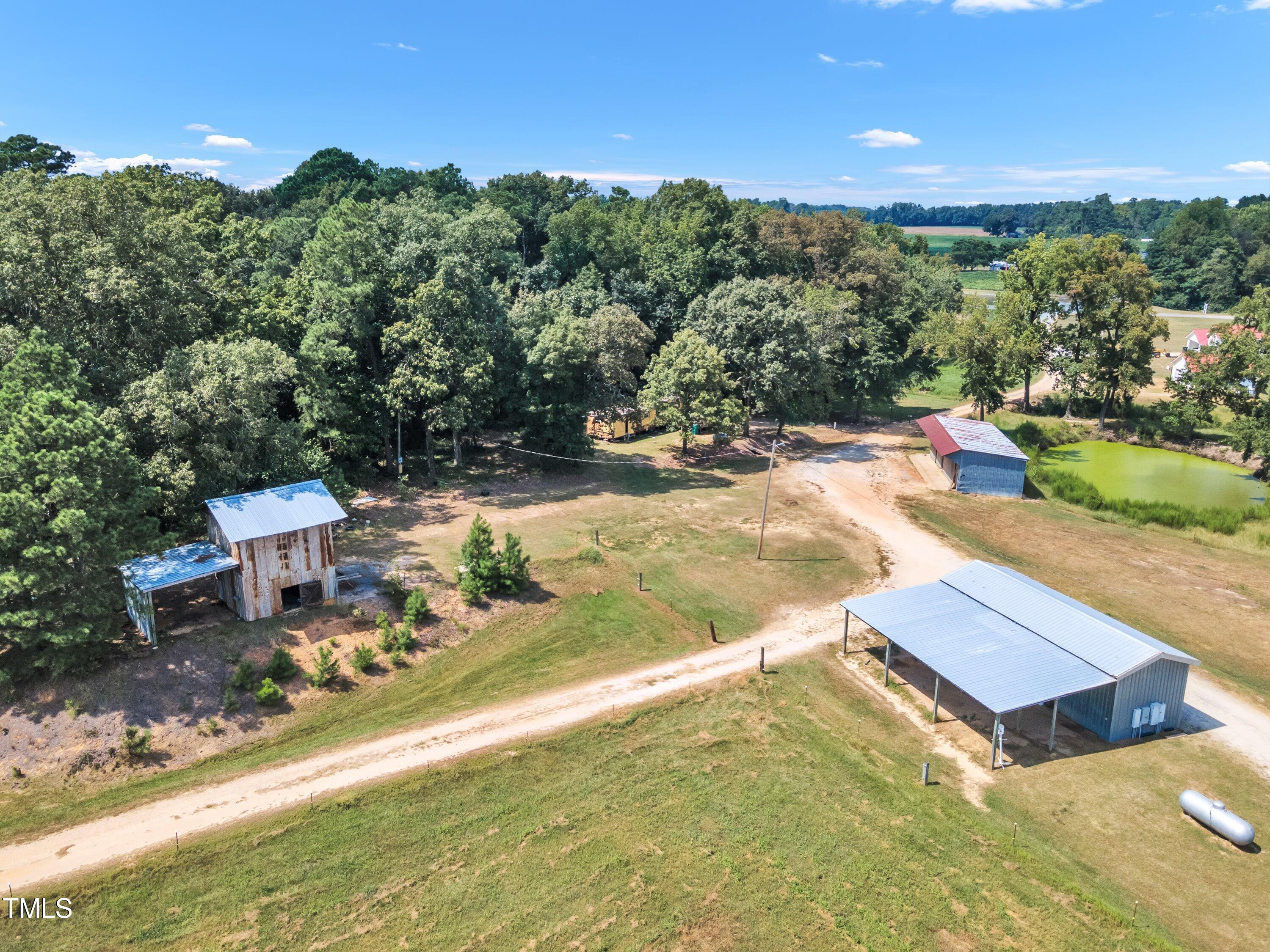 8585 Stricklands Crossroads Road Four Oaks, NC 27524 - Photo 21 of 30 an aerial view of a house