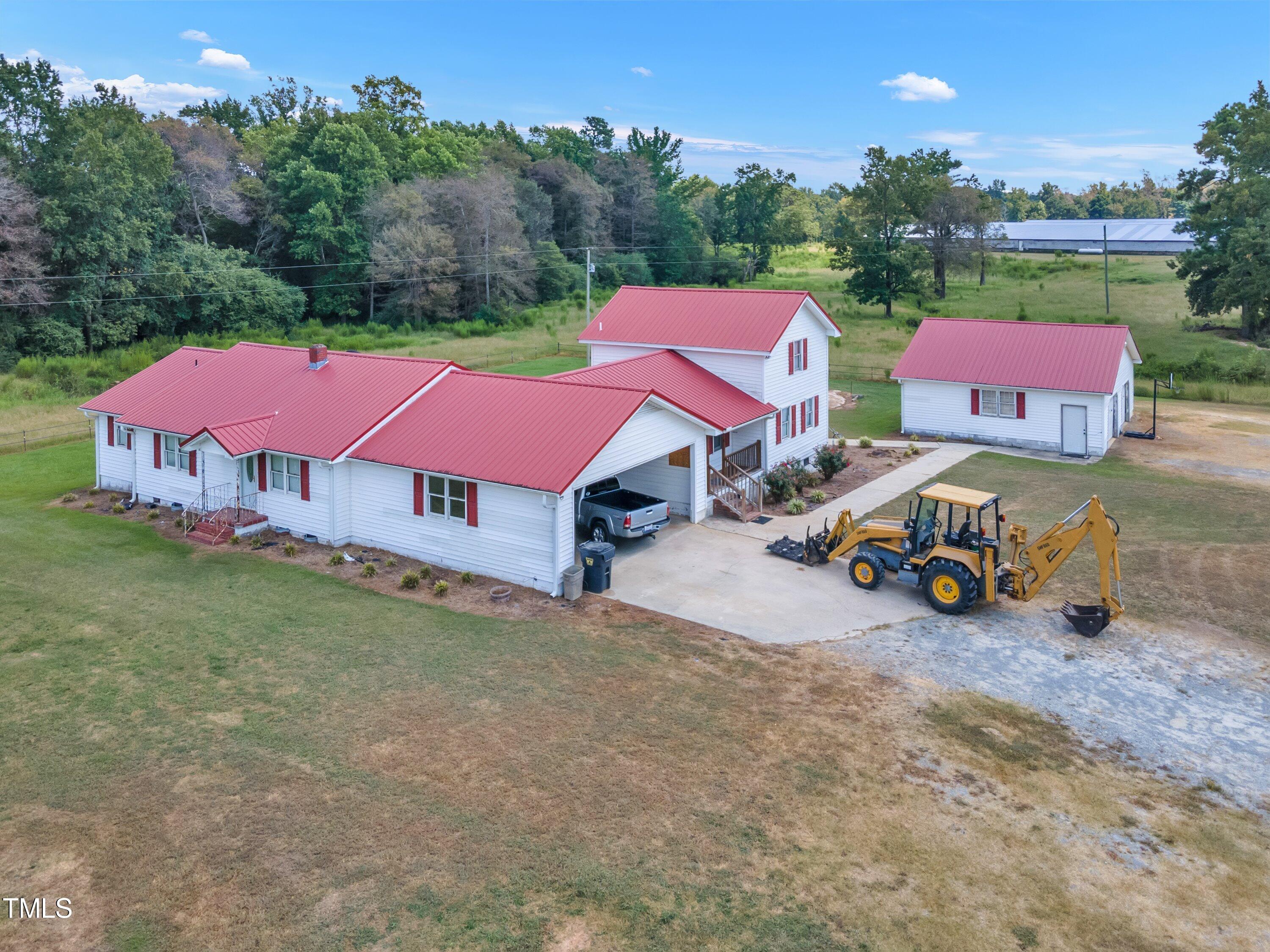 8585 Stricklands Crossroads Road Four Oaks, NC 27524 - Photo 27 of 30 a view of a yard with cars