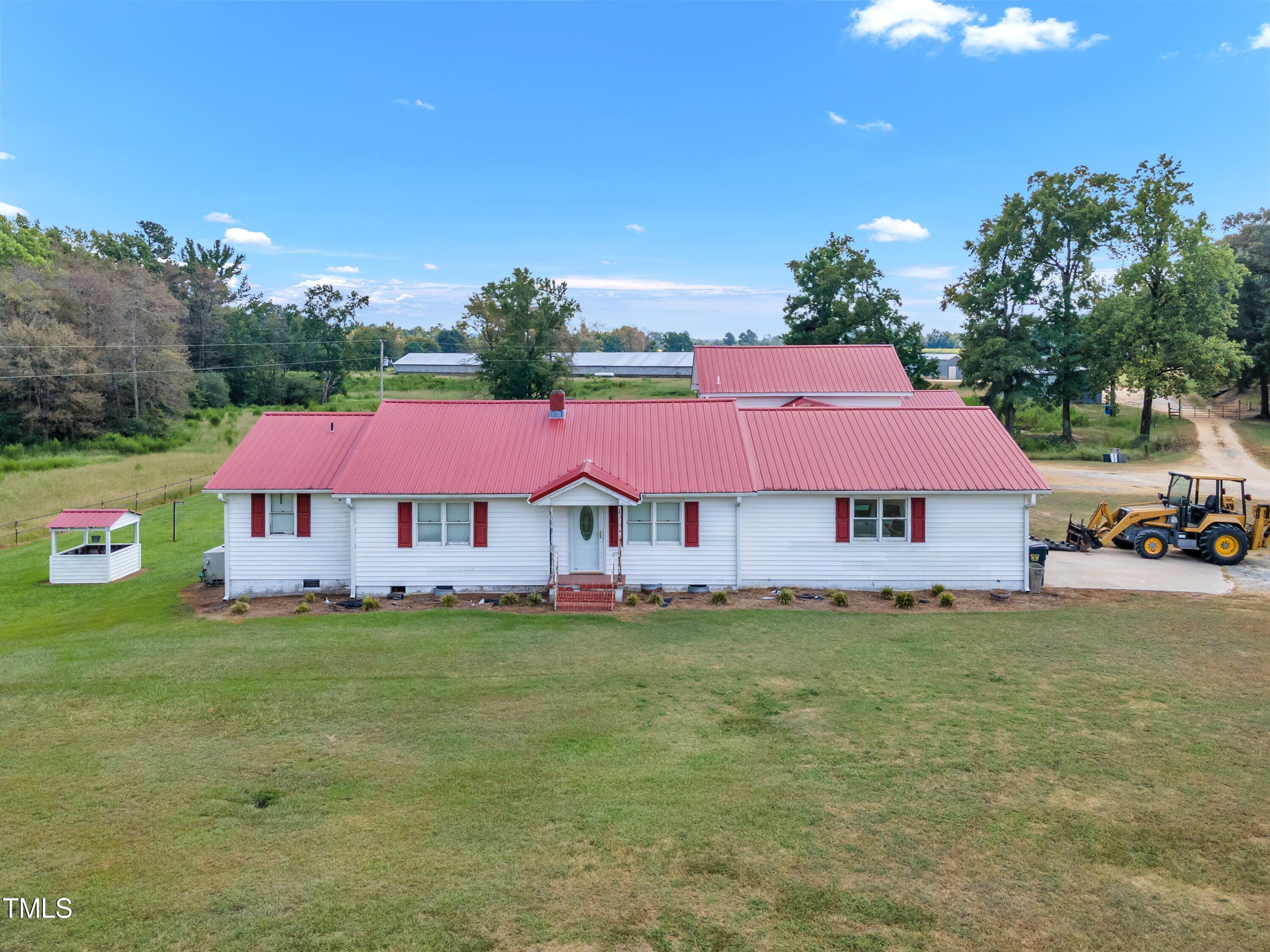 8585 Stricklands Crossroads Road Four Oaks, NC 27524 - Photo 28 of 30 a view of a house with a yard
